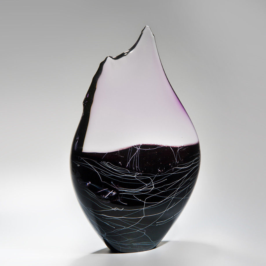 blown and sculpted glass ornament in abstract teardrop shape in black clear and pink 