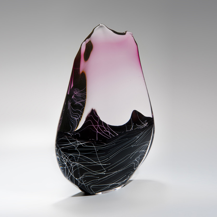 blown and sculpted glass ornament in abstract teardrop shape in black clear and pink 
