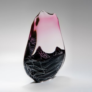 blown and sculpted glass ornament in abstract teardrop shape in black clear and pink