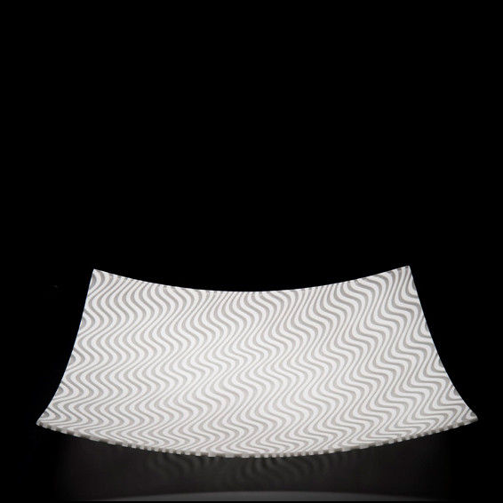 art glass rectangular dish in white with black optical pattern