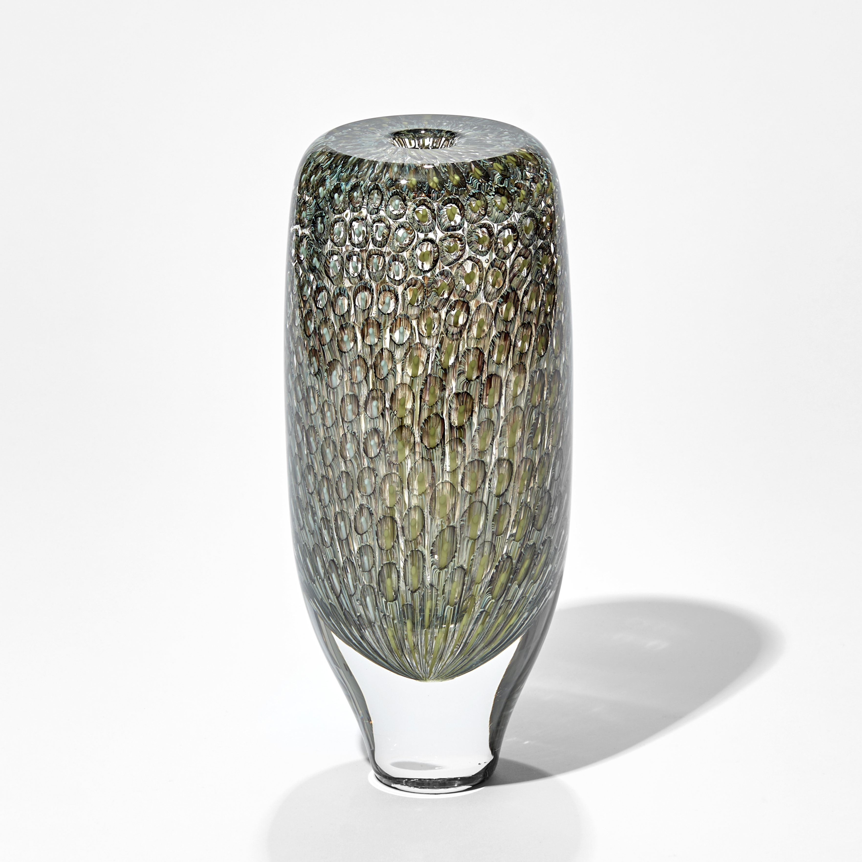 tall transparent cylinder vase with tapered base and flat top with fine trapped repeat pattern in grey celadon olive khaki and brown hand made from glass