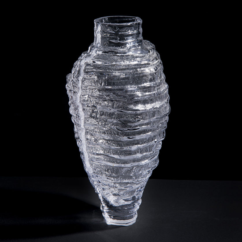 clear glass sculpted decorative tall vessel artwork with ribbed exterior pattern