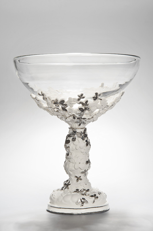 clear glass bowl sculpture with ornate porcelain base in white and grey