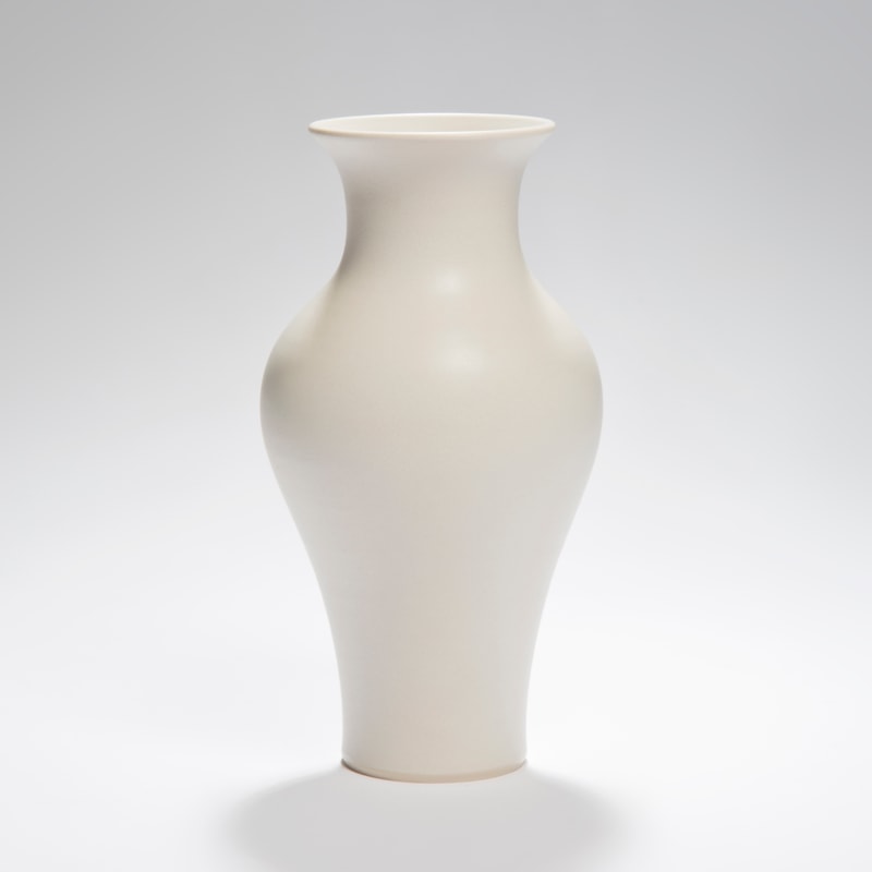 white vase ornament sculpture with wider upper mid section
