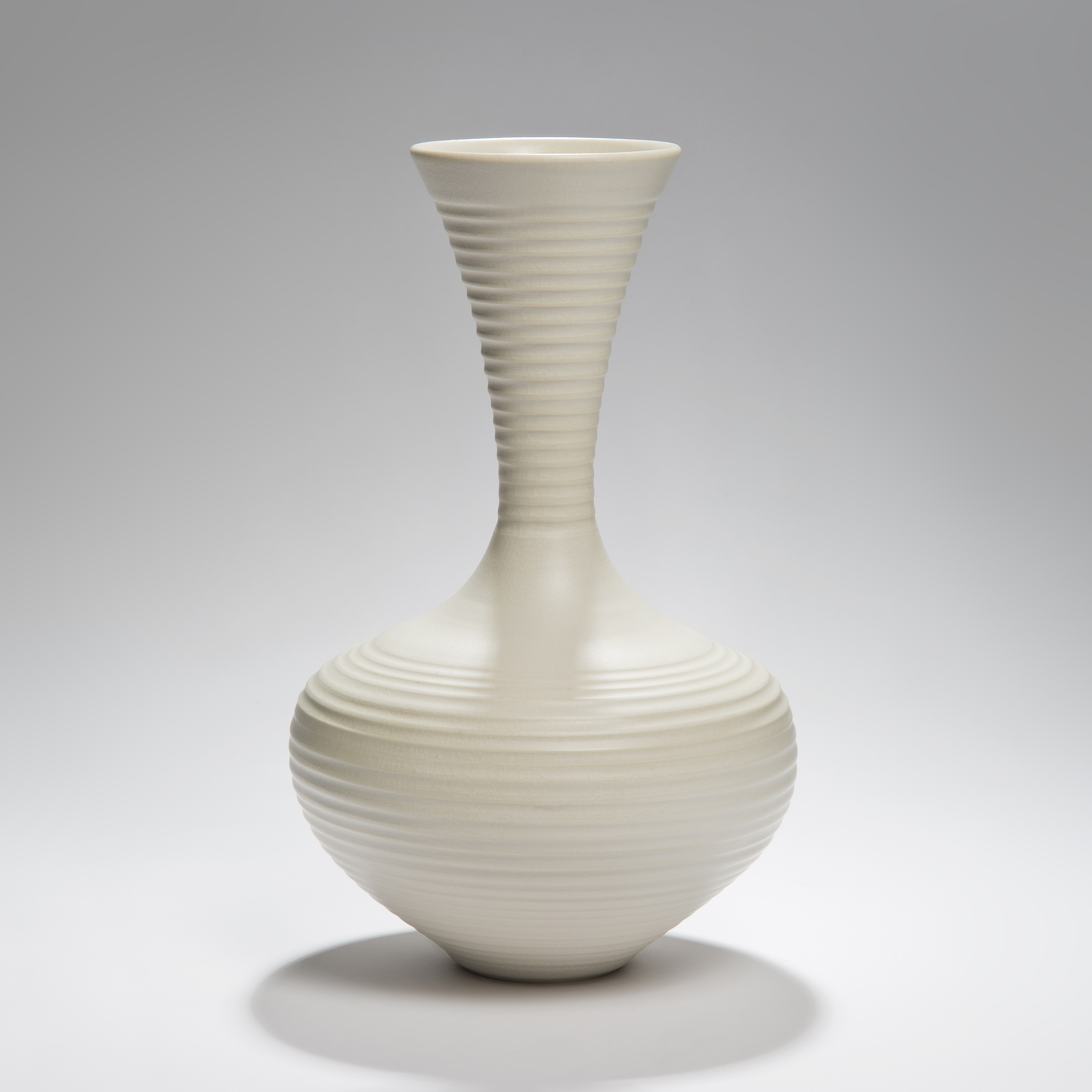 large ridged porcelain vase sculpture in cream