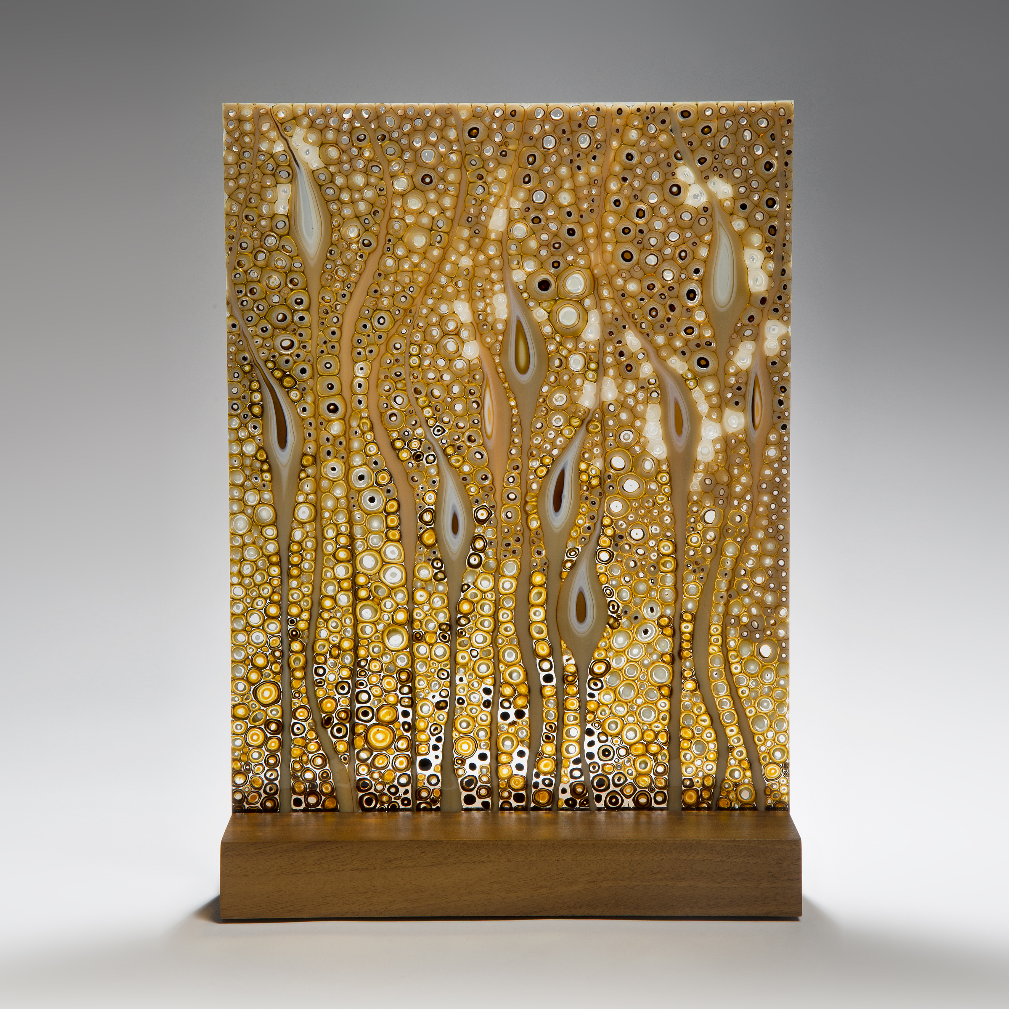 large fused glass art panel of flowers in gold
