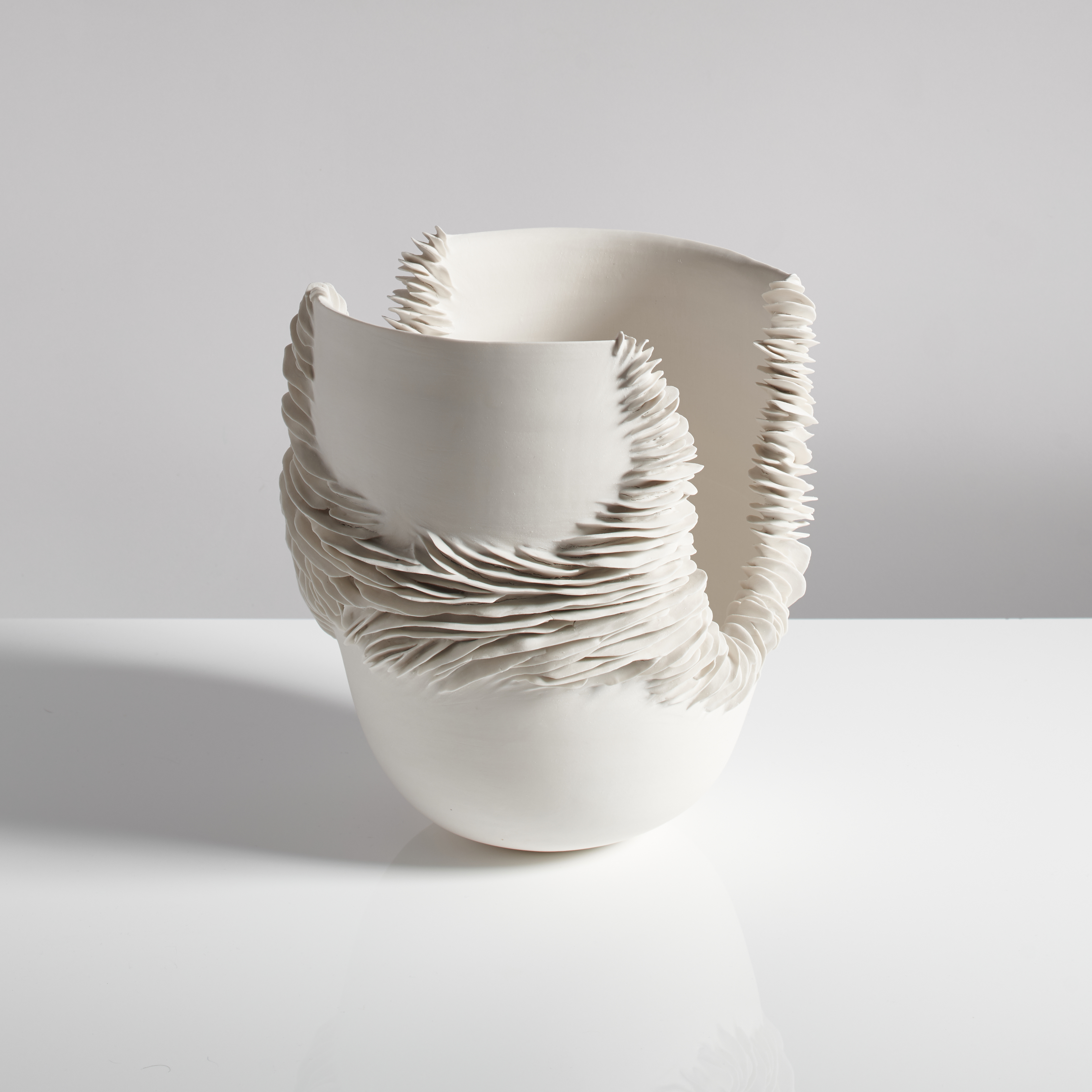 tall porcelain wrapping bowl sculpture with detailed trim