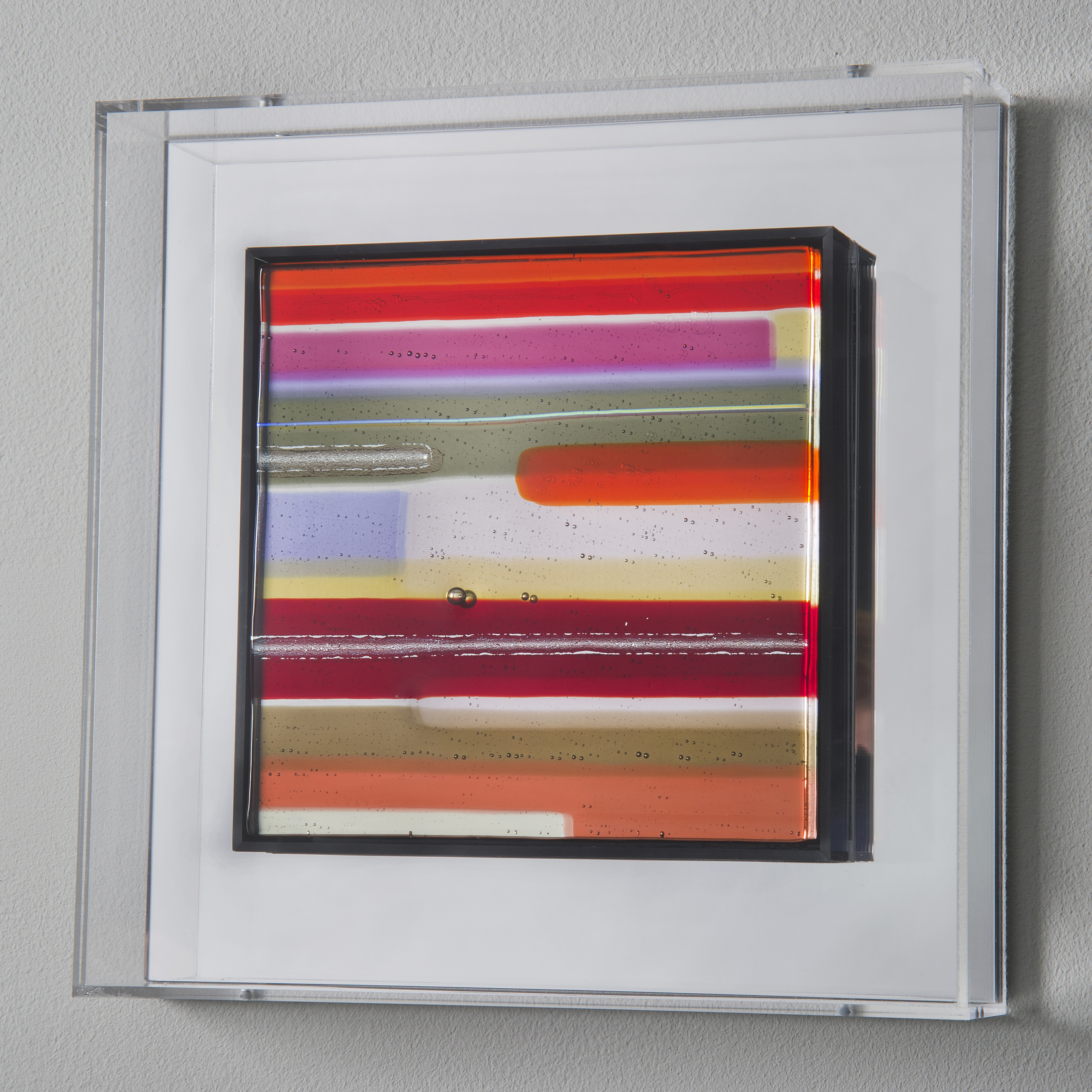 modern glass wall art in minimalist line colours in acrylic box