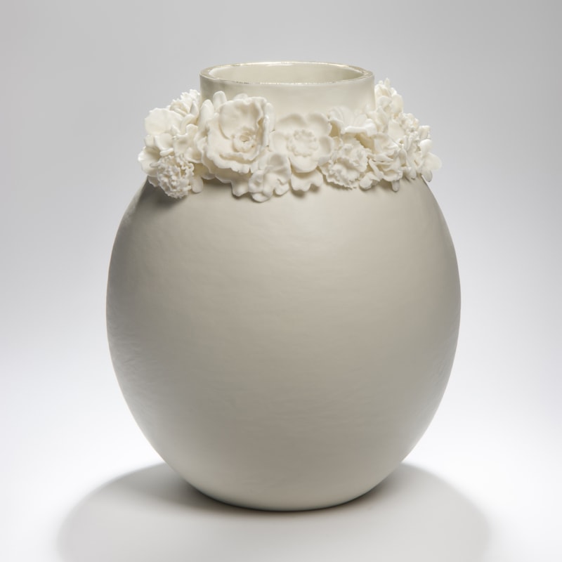 porcelain forget me not vase sculpture with gold lustre trim around the top edge