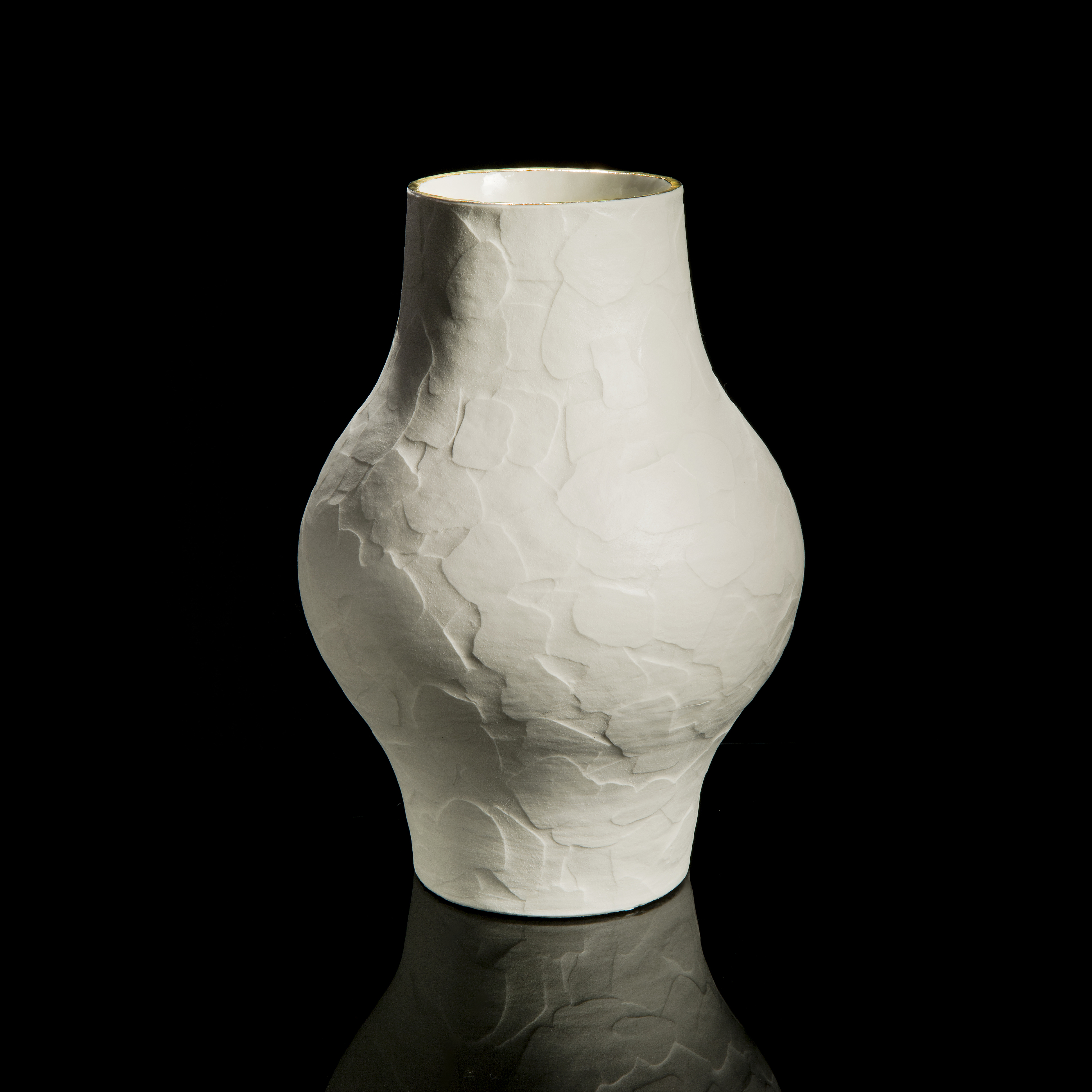 porcelain ceramic sculptured vessel with wider midriff