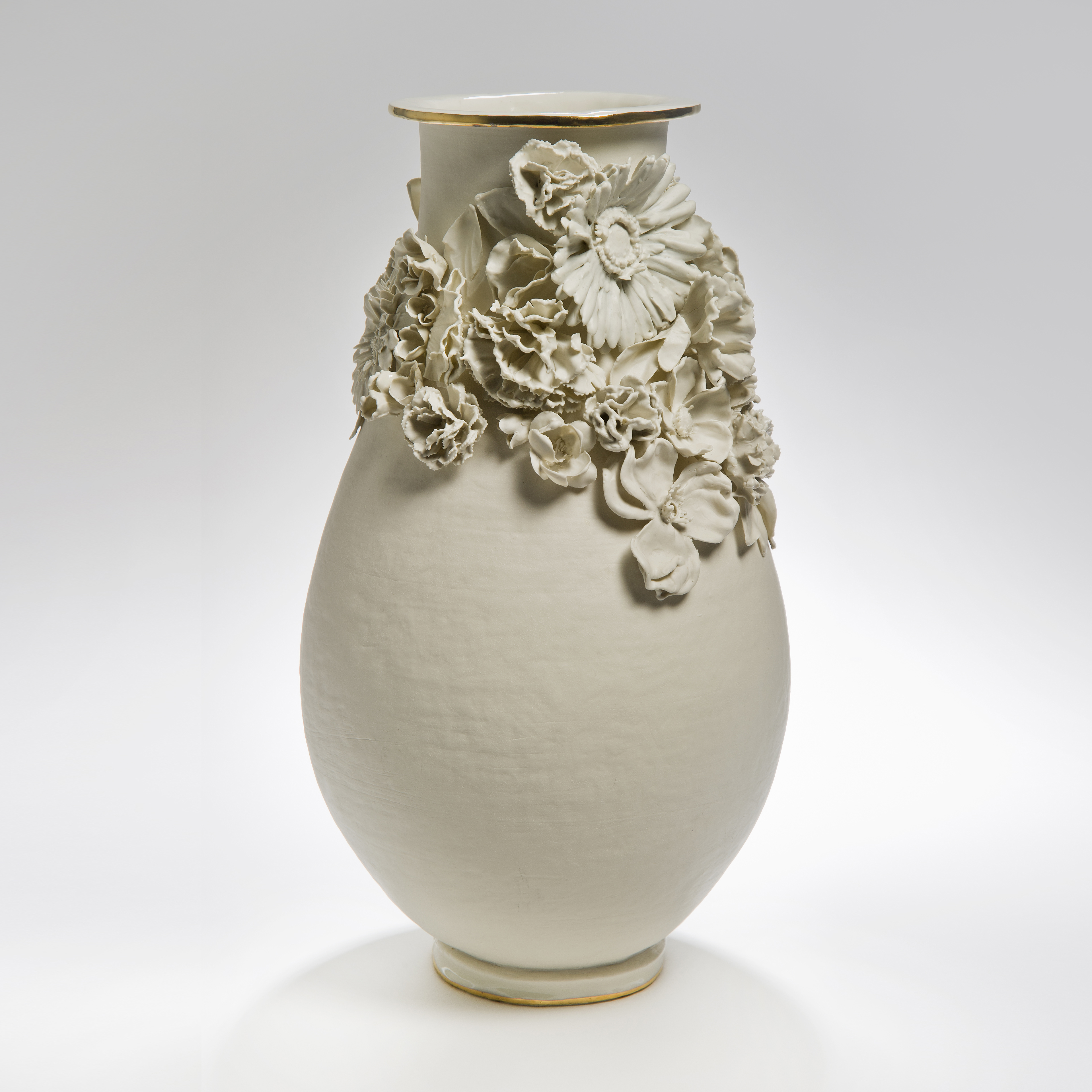 sculpted white medium sized porcelain vase with flower decoration