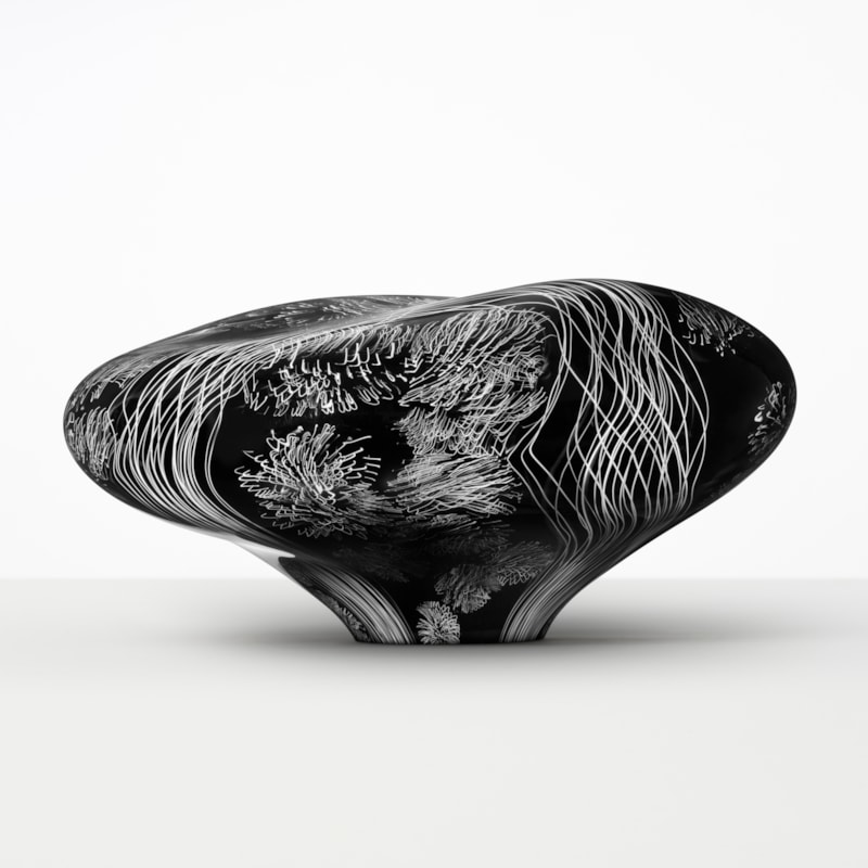 abstract brain-shaped clear glass sculpture in black with white etched patterning throughout
