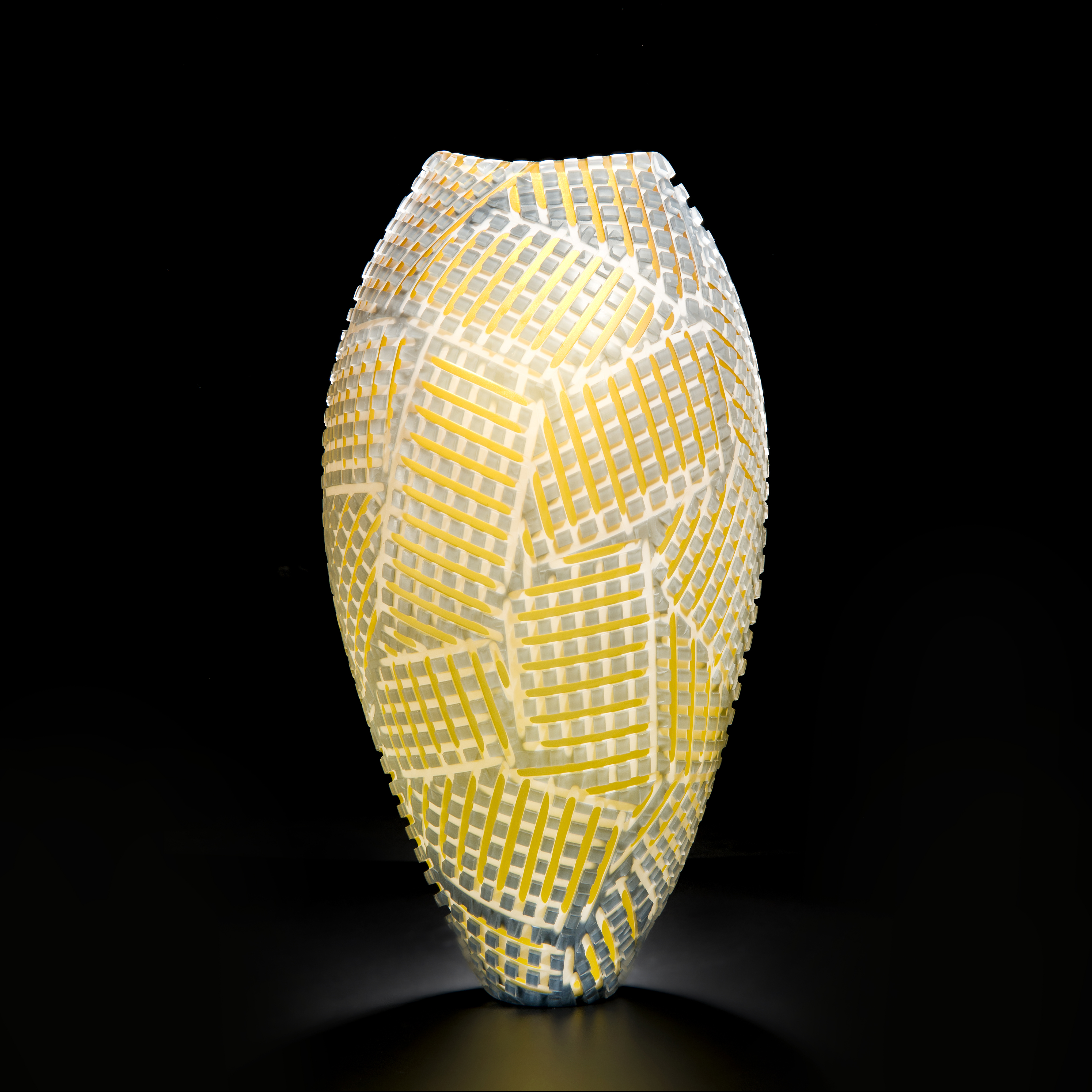 art glass vase with crossing amber stitch pattern