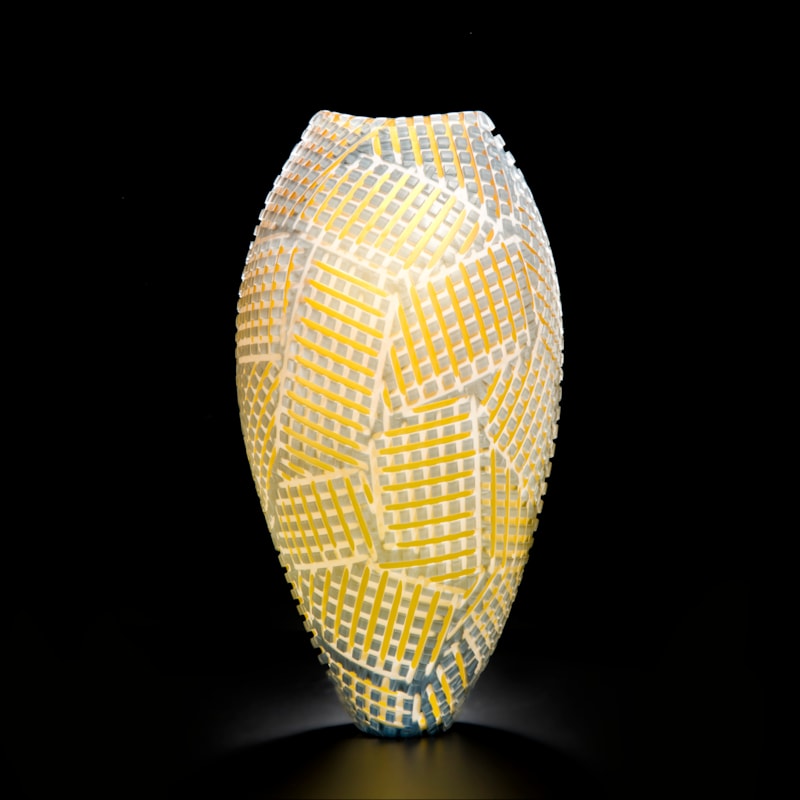 art glass vase with crossing amber stitch pattern