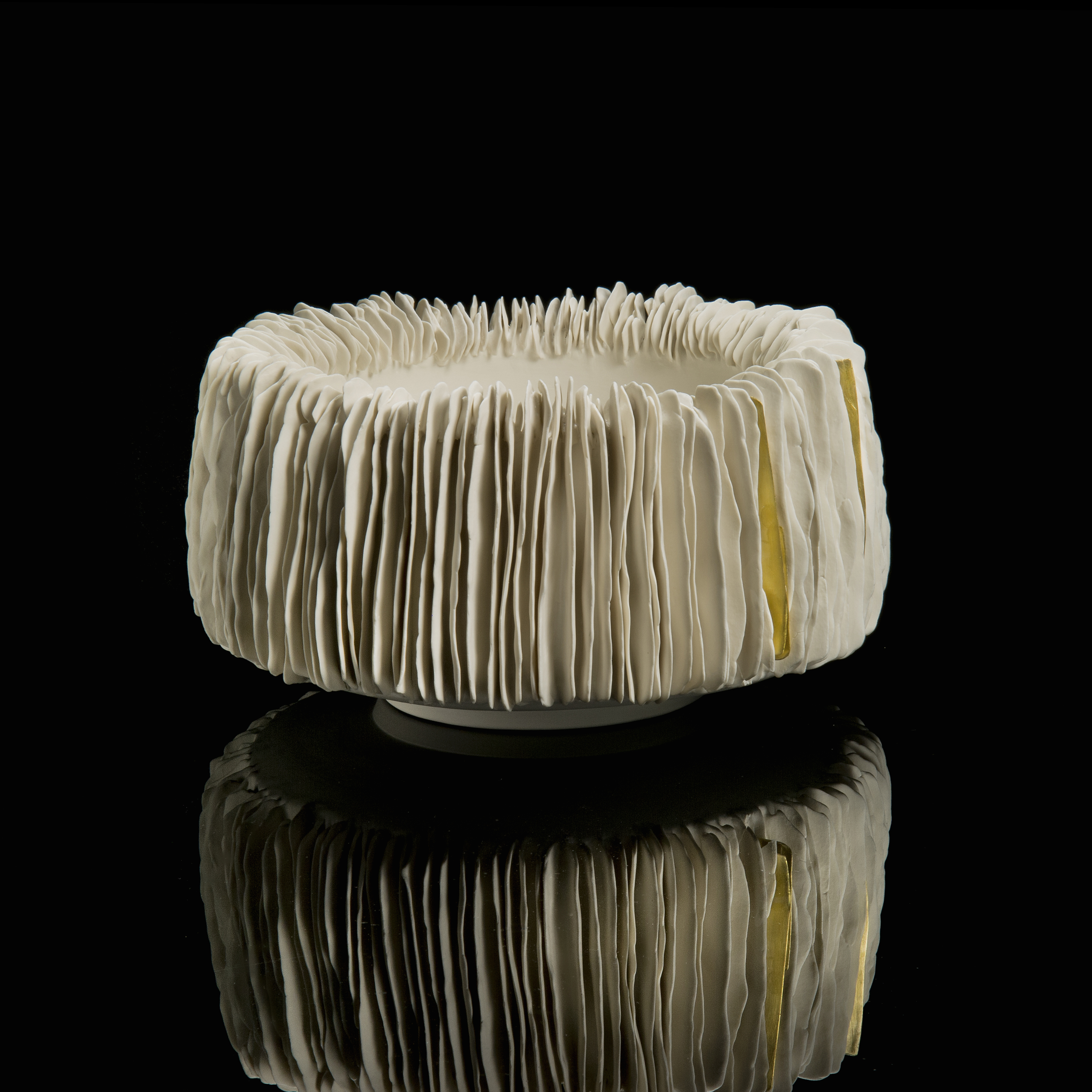 white ceramic sculpted wide vertical bowl with fanned edge