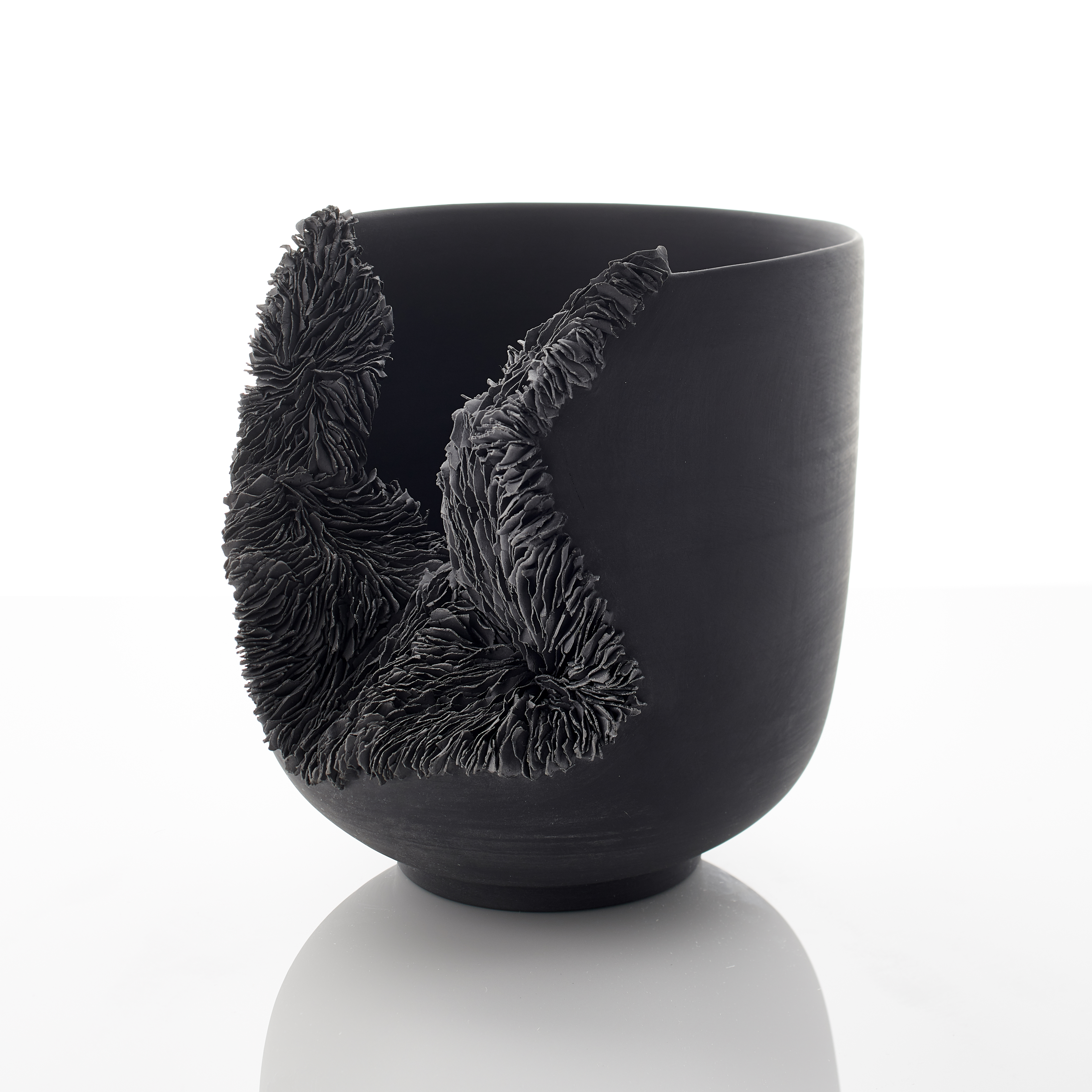 modern porcelain sculpture art of bowl in black with collapsed open side