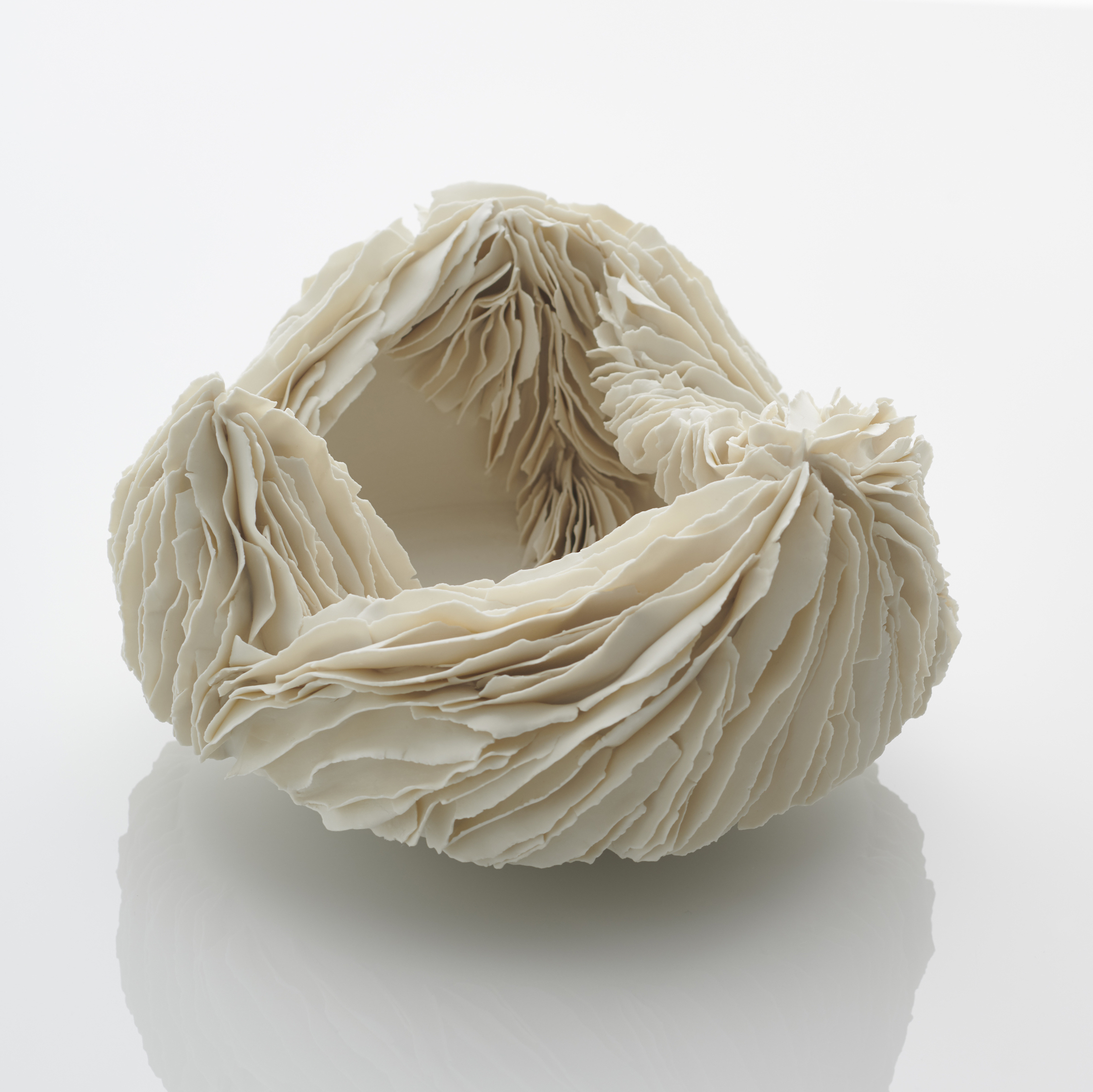 white porcelain art sculpture of an open bowl with layered edges