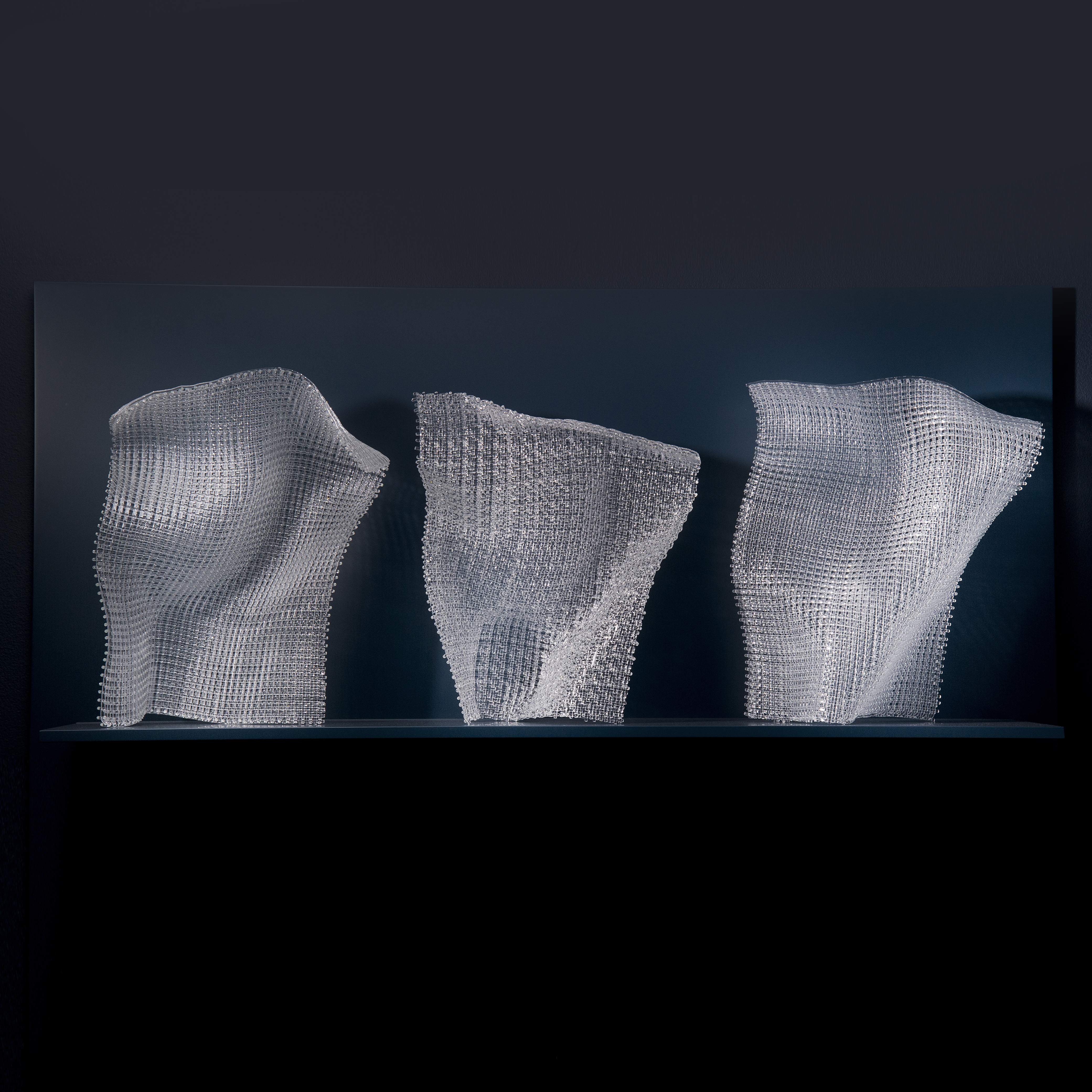 triptych of modern fused and layered glass sculpture in abstract forms