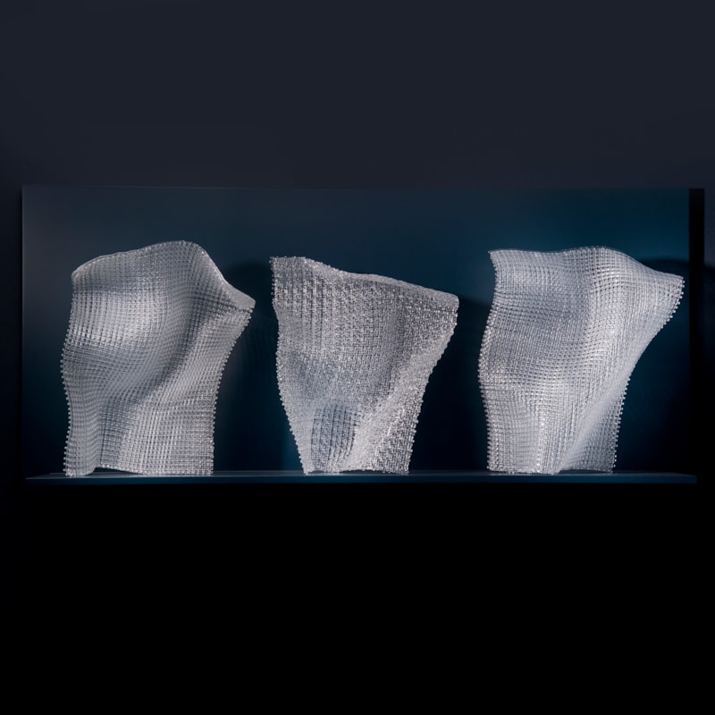 triptych of modern fused and layered glass sculpture in abstract forms