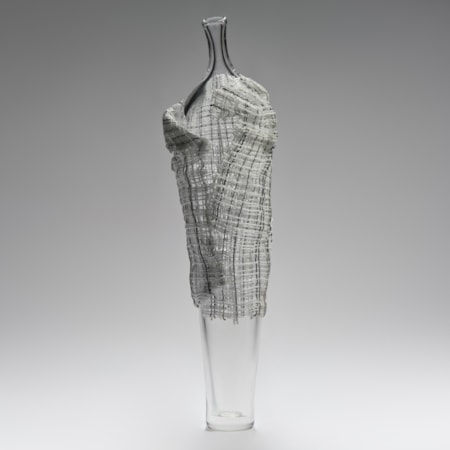 tall contemporary art-glass sculpture of vase with cane cloak resembling human form