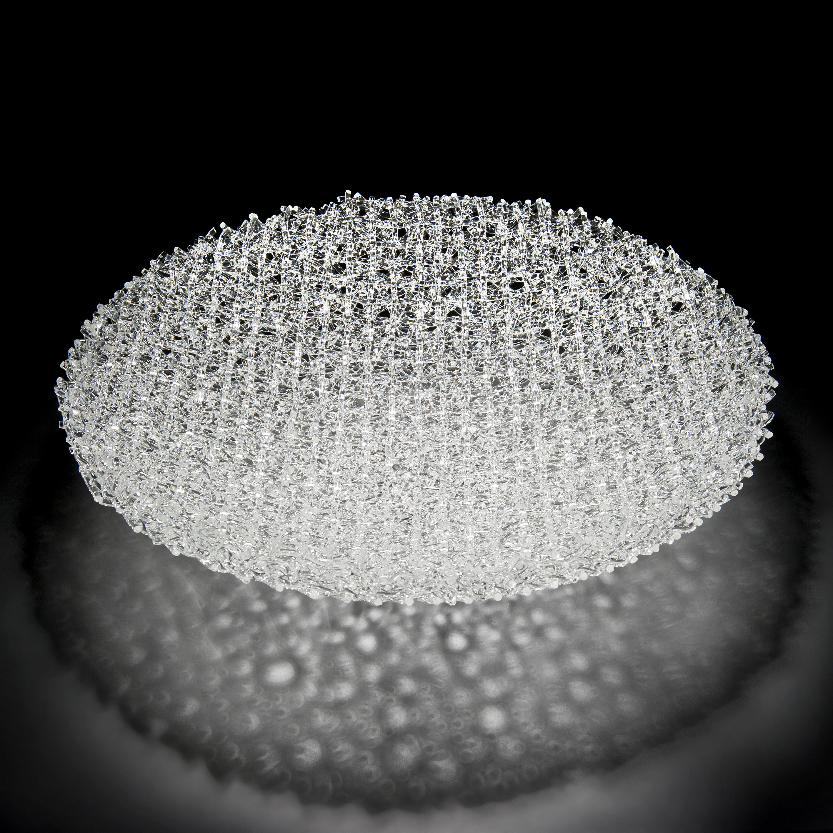 concave mesh bowl-shaped modern art-glass sculpture in crystal