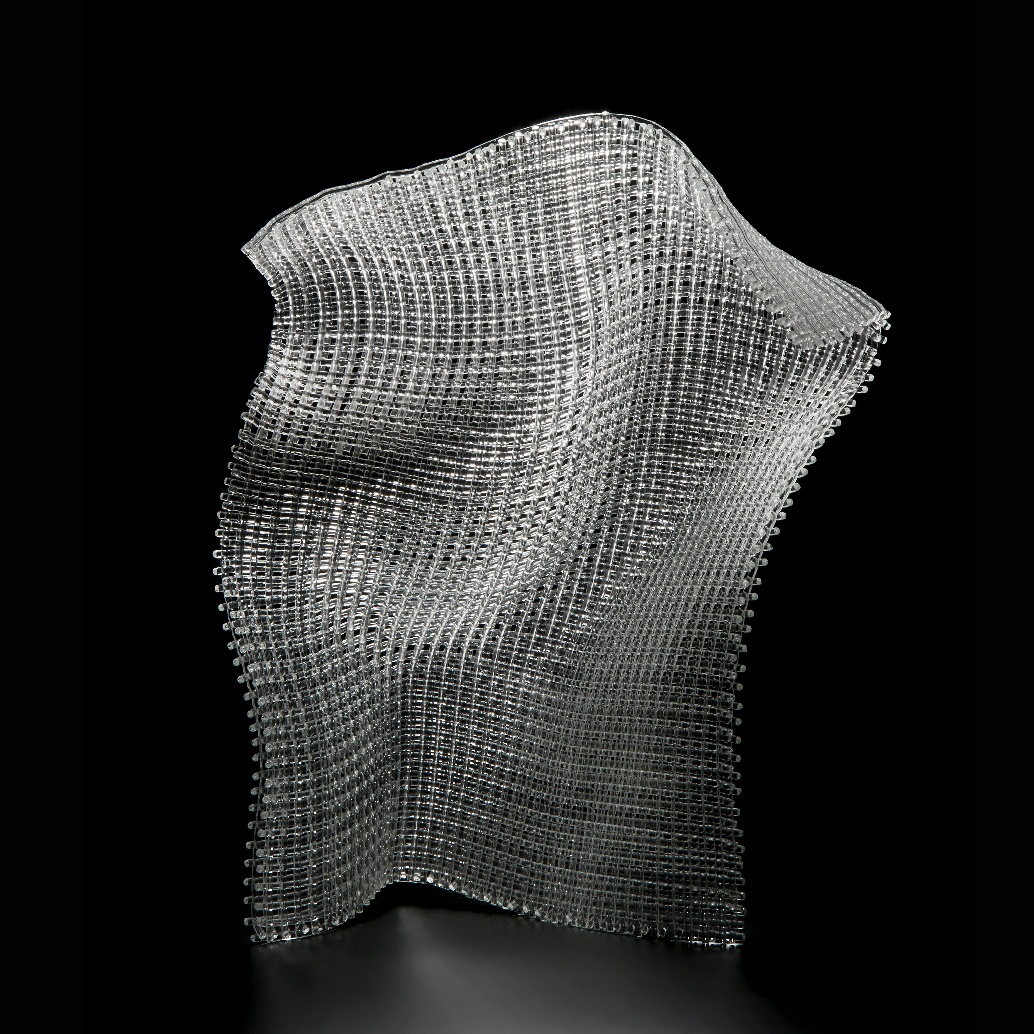 contemporary abstract art-glass sculpture resembling cloth stood upright
