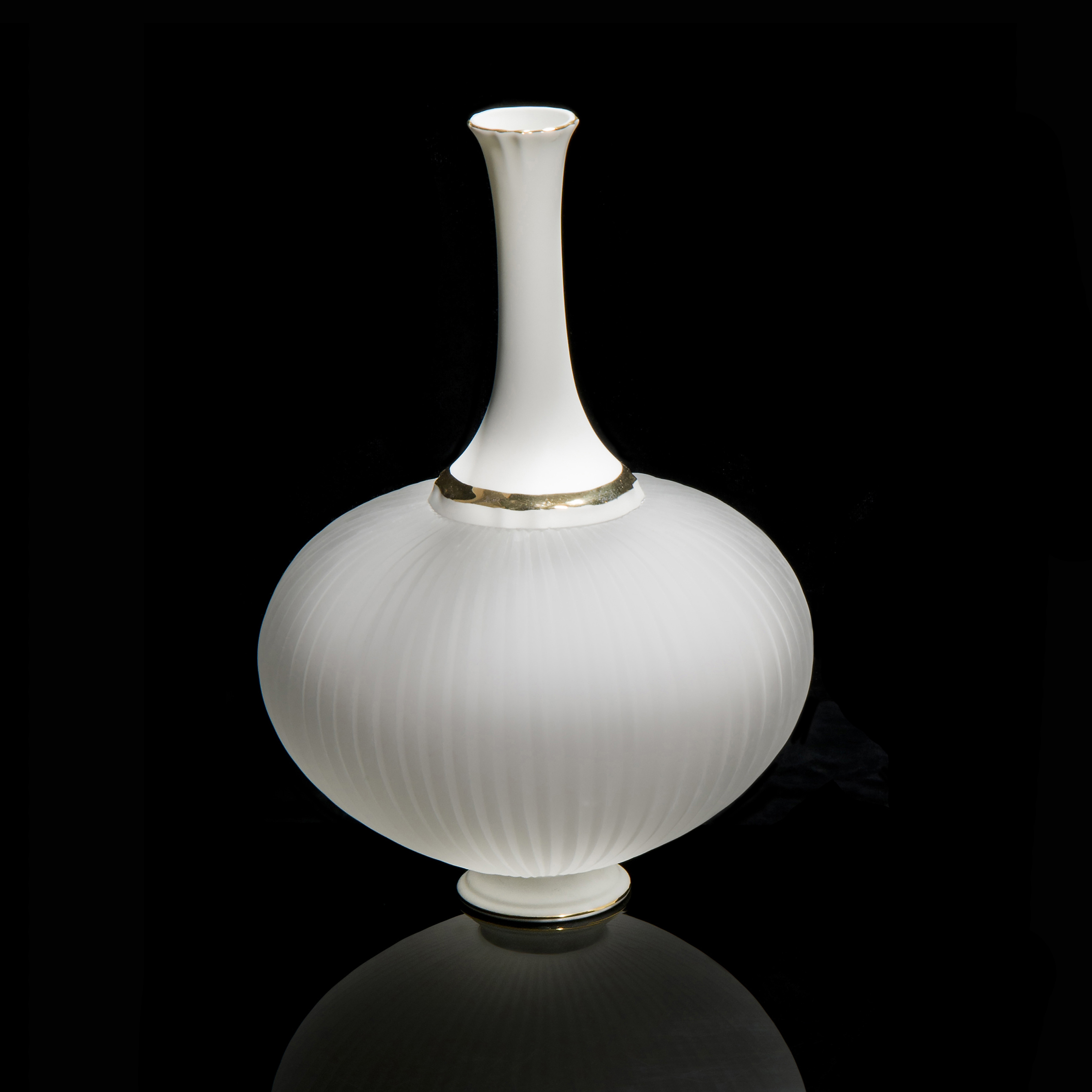 white glass and ceramic sculpture with wide base and long neck