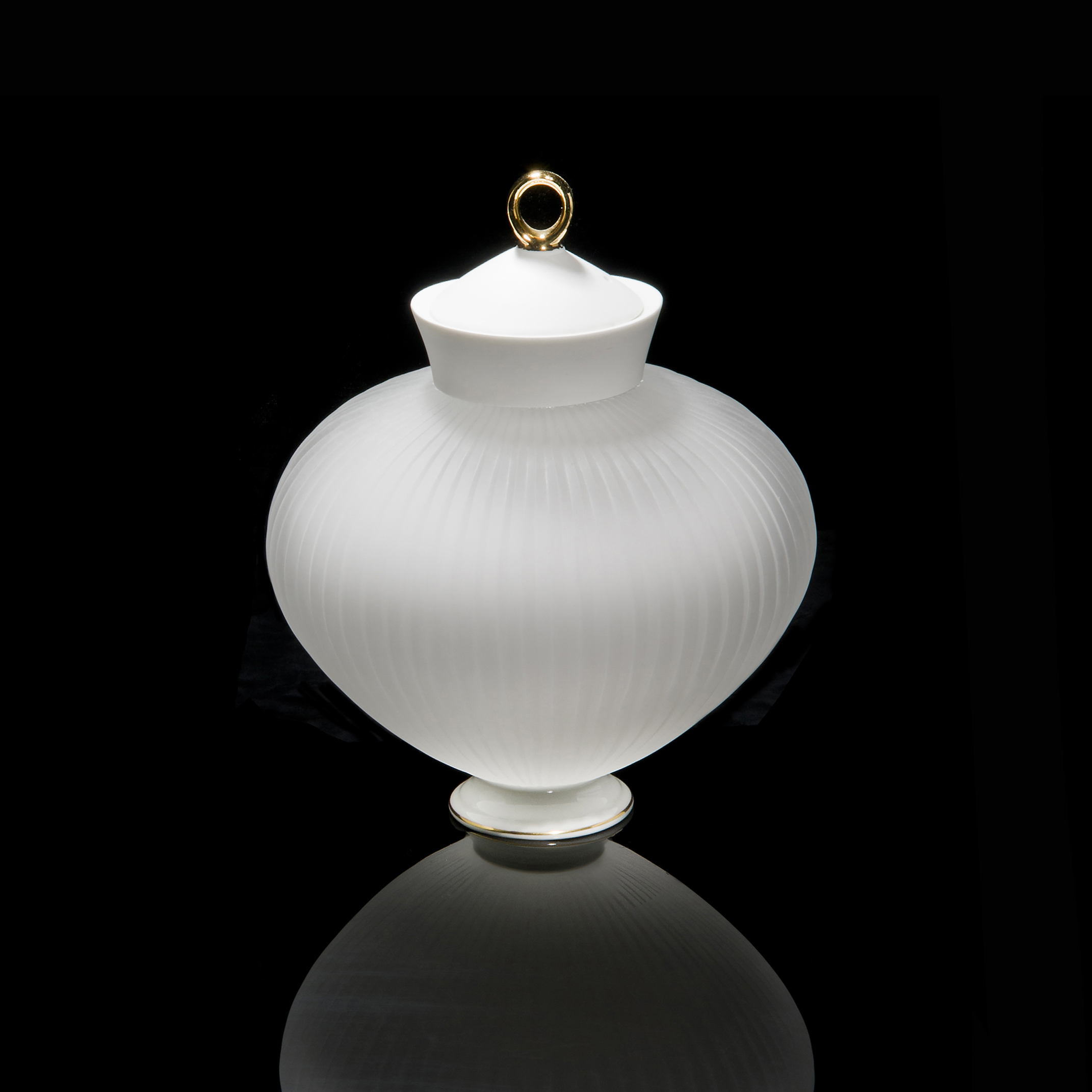 glass and ceramic teapot shaped art sculpture in white and gold