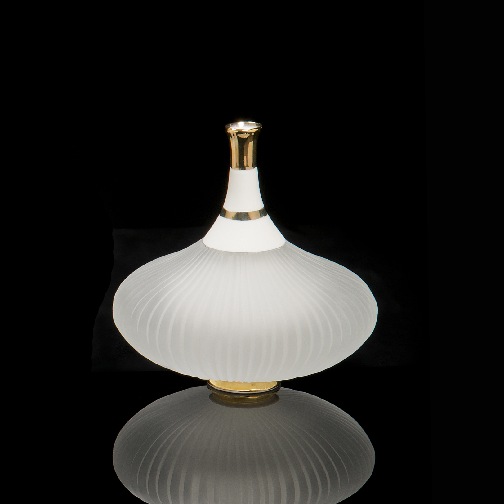 glass and ceramic art sculpture of a teapot in white and gold