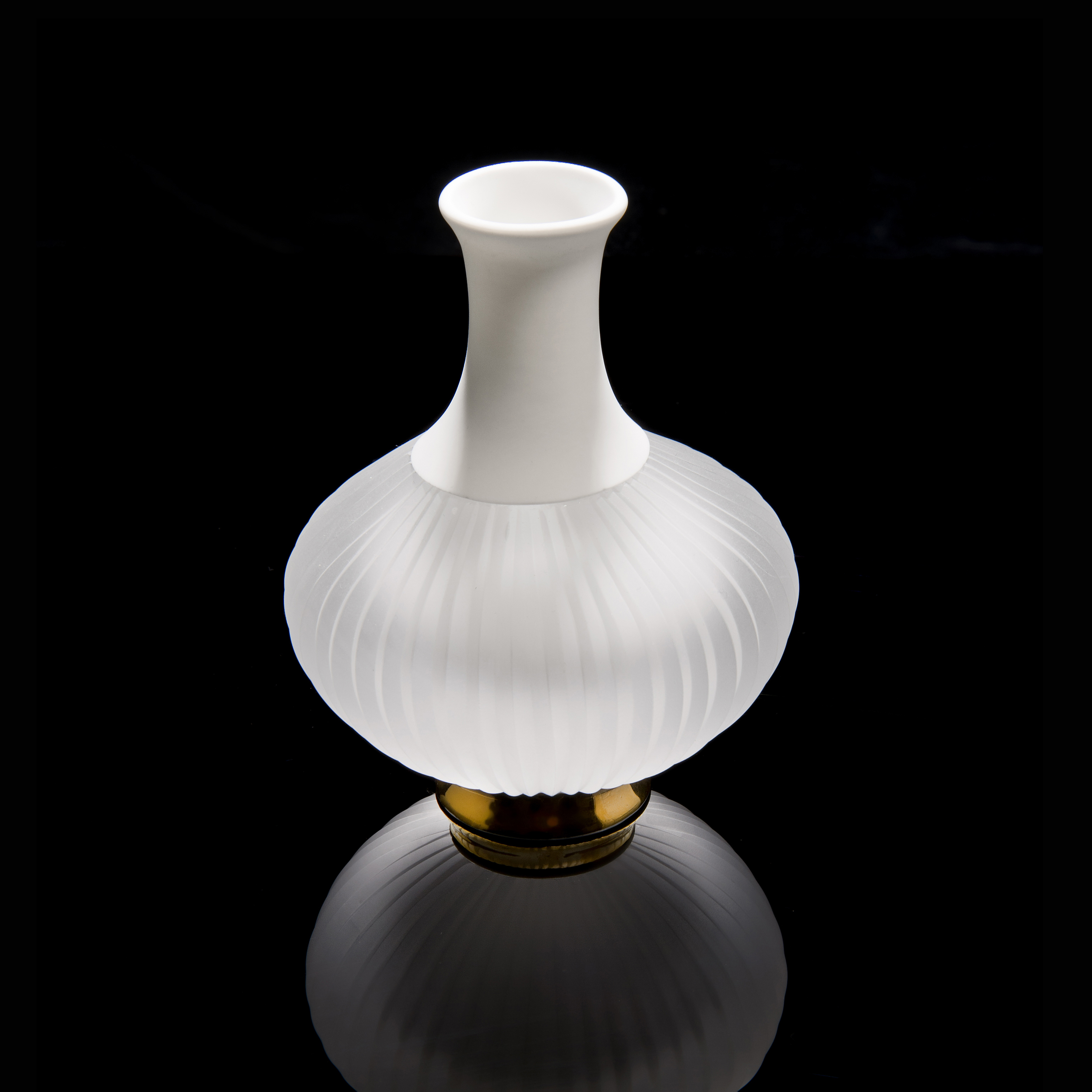 sculpted glass and porcelain vessel with wide base and long neck on gold base