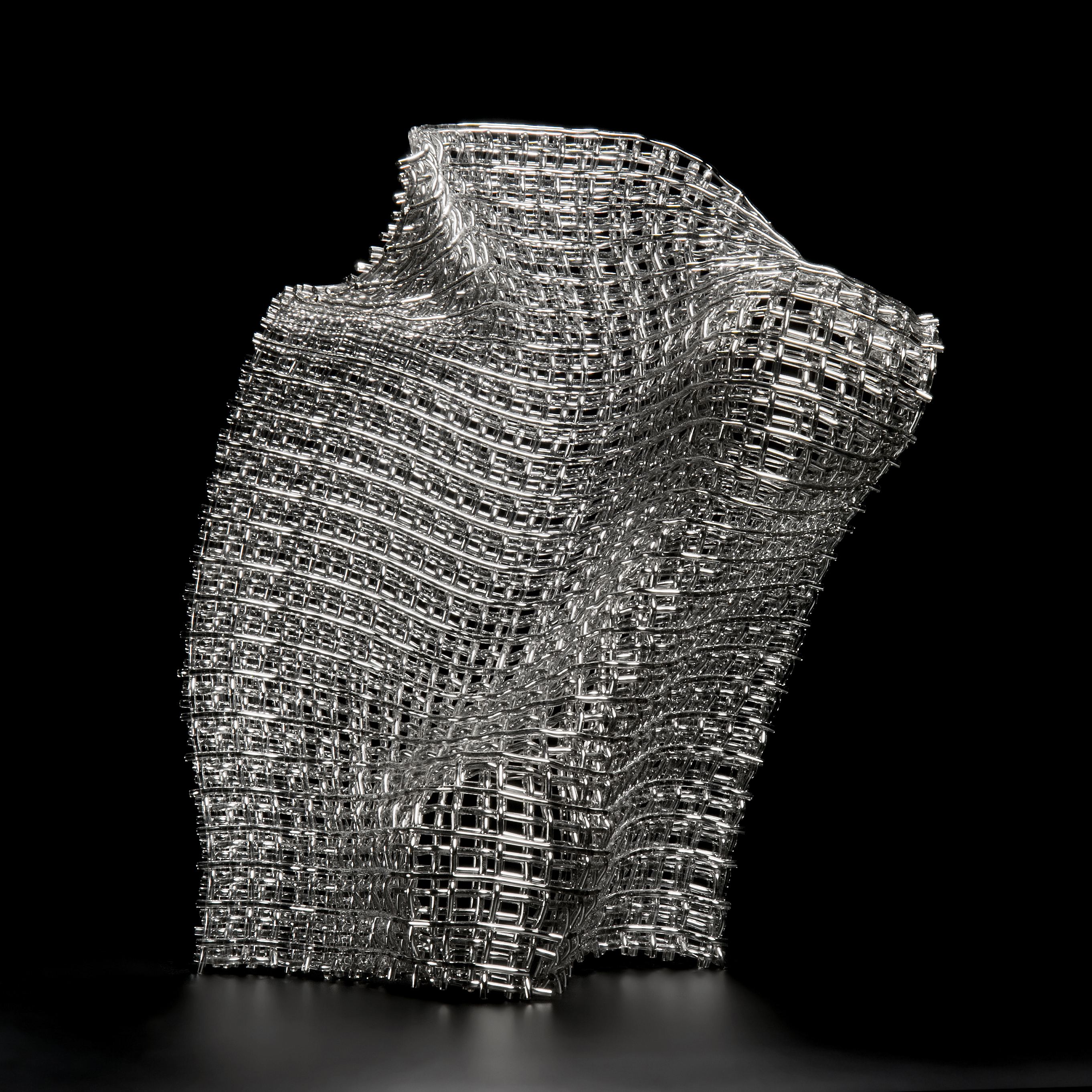 layered fused glass sculpture resembling structural mesh