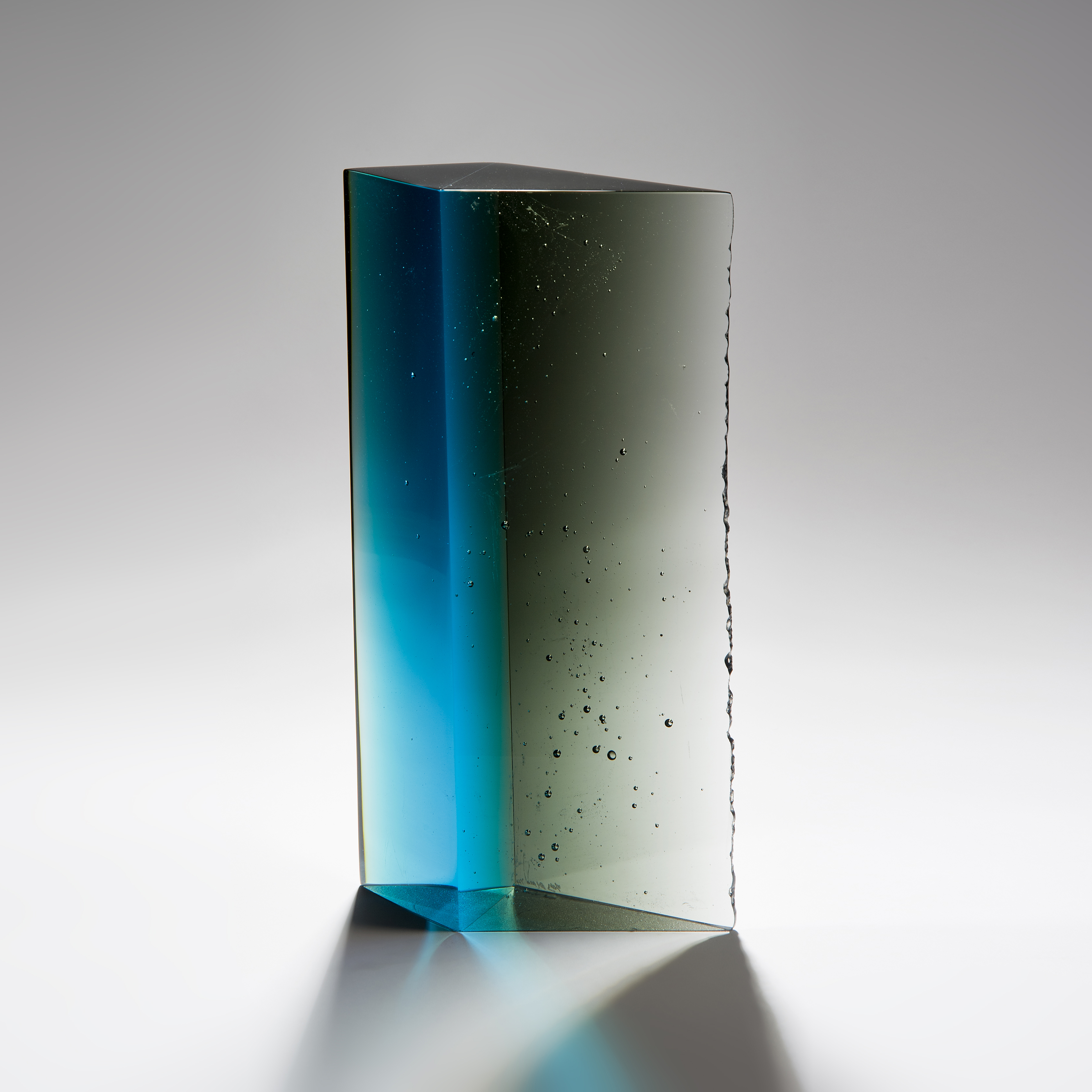 modern rectangular art glass sculpture in blue green and turquoise