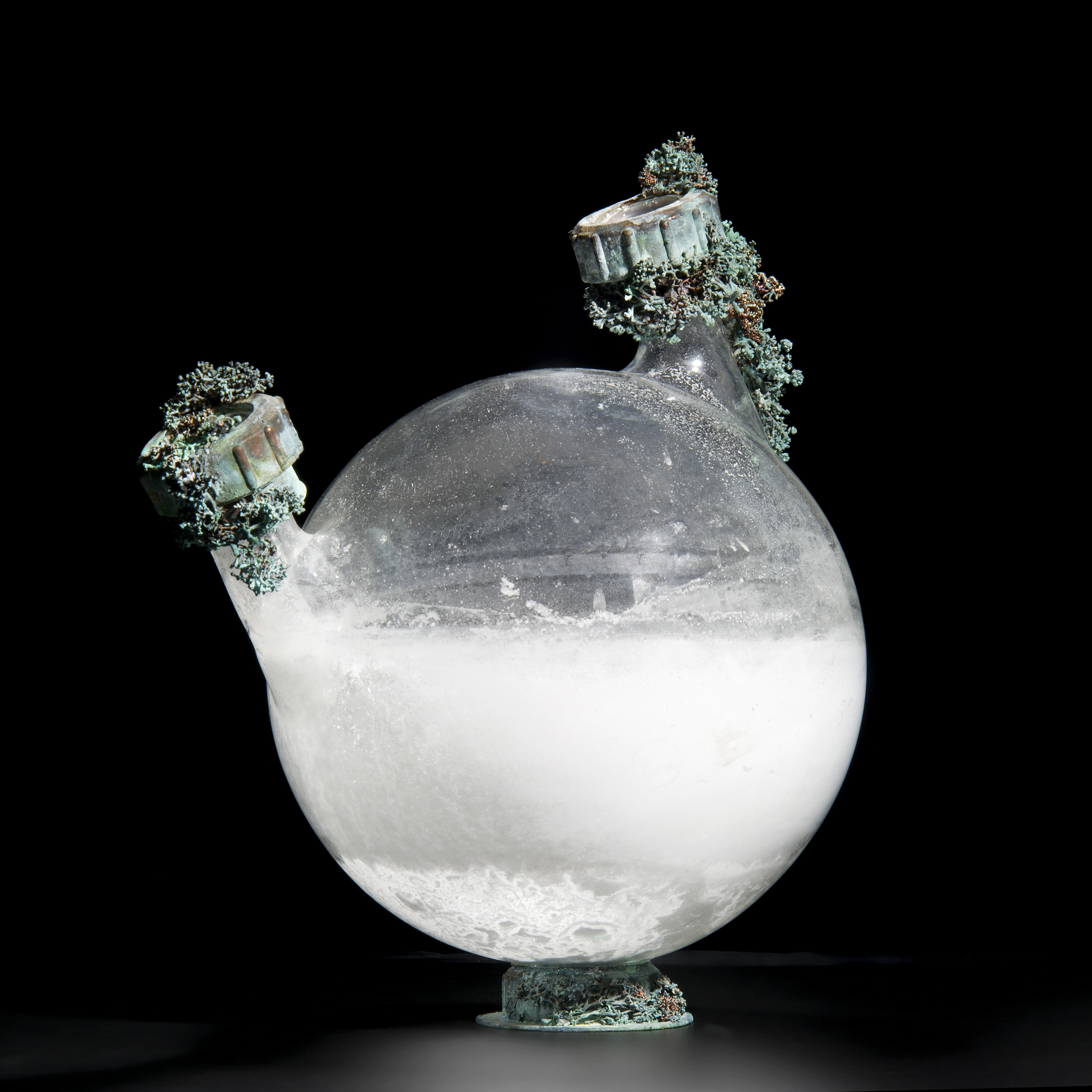 art-glass globe sculpture of water container with metal adornments 