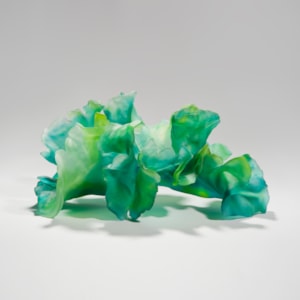 contemporary art-glass sculpture of leaves in bright green
