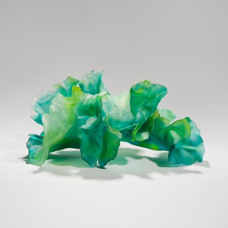 contemporary art-glass sculpture of leaves in bright green