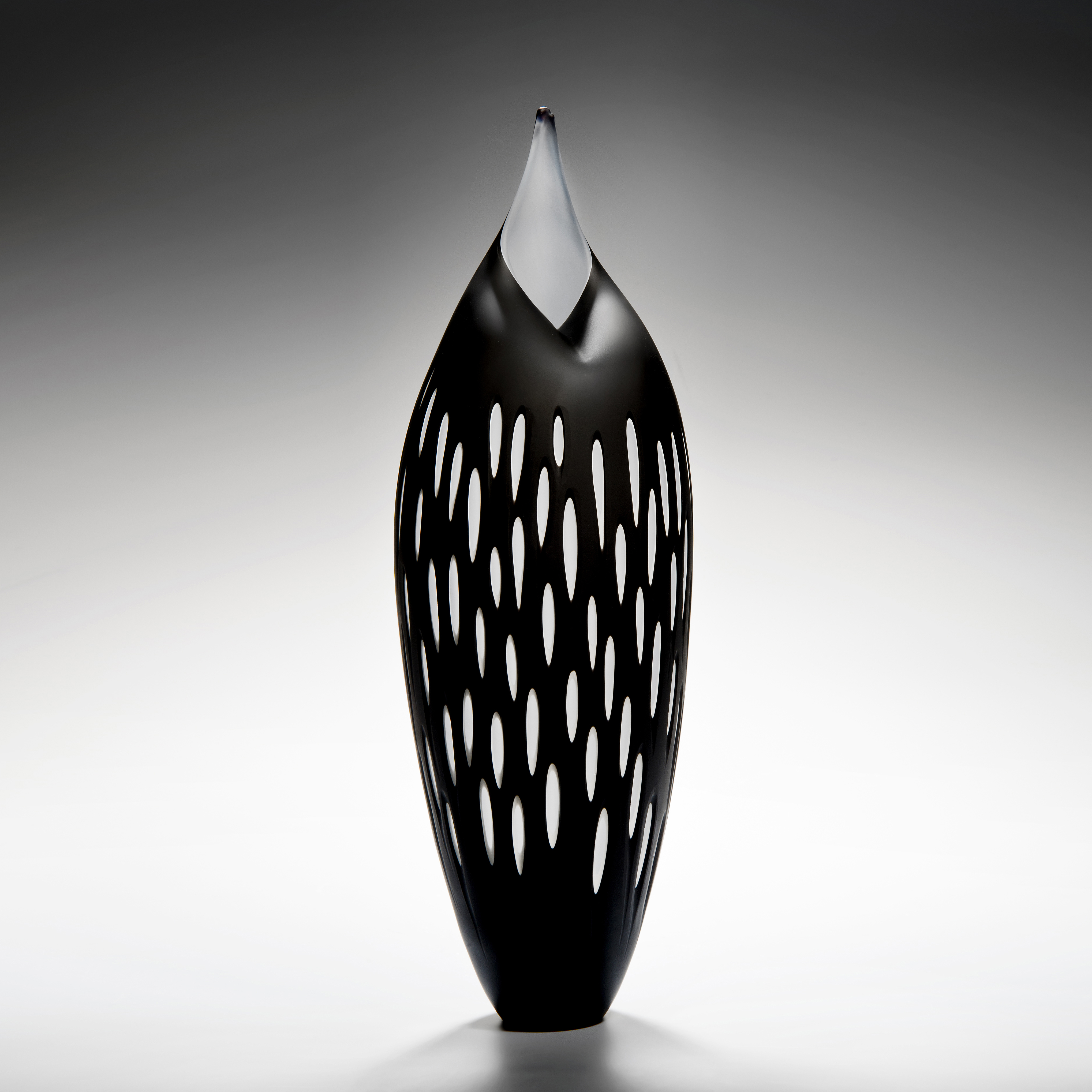 bird like glass artwork in black with white trim