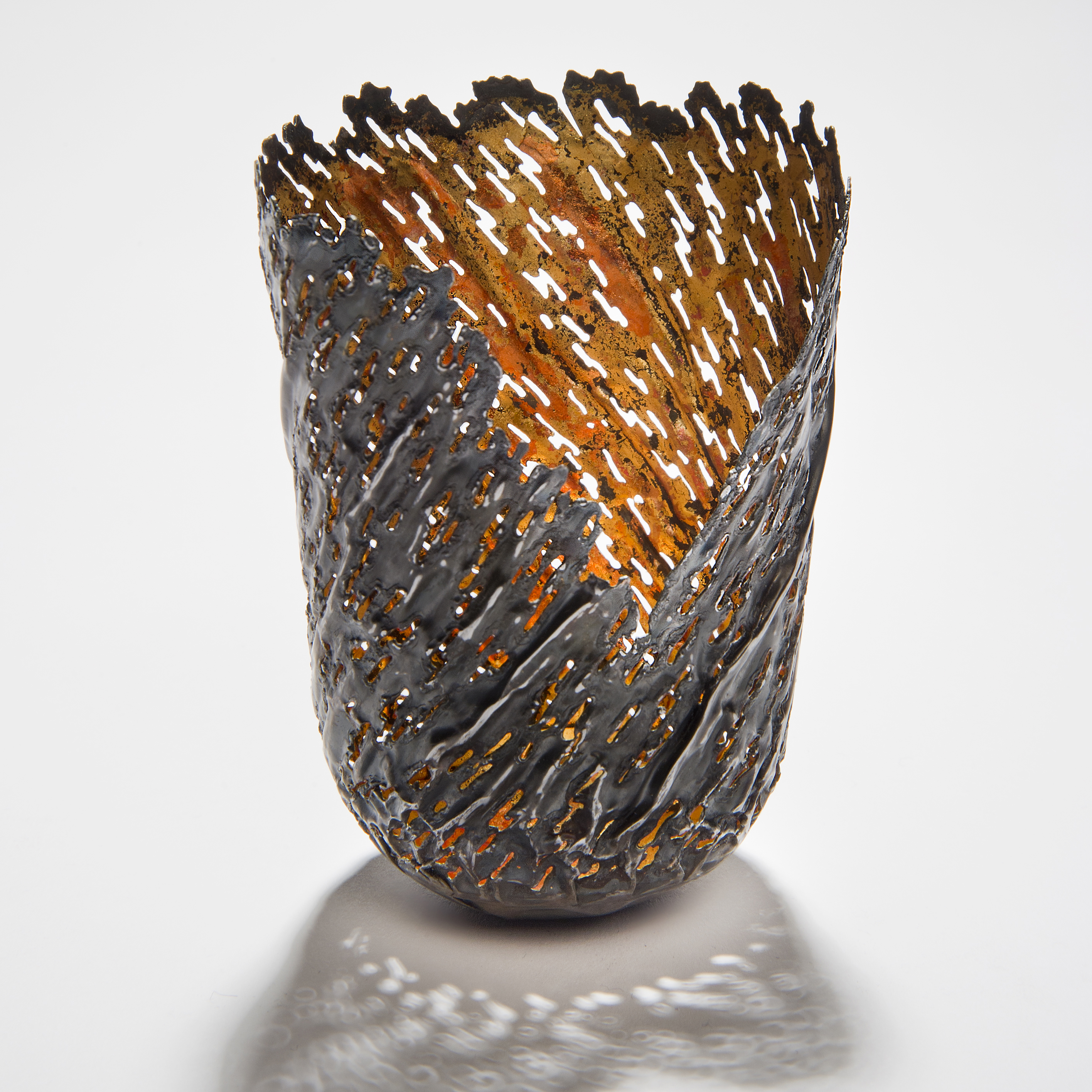 contemporary art sculpture of re-formed steel can with orange gold inlay and open edge
