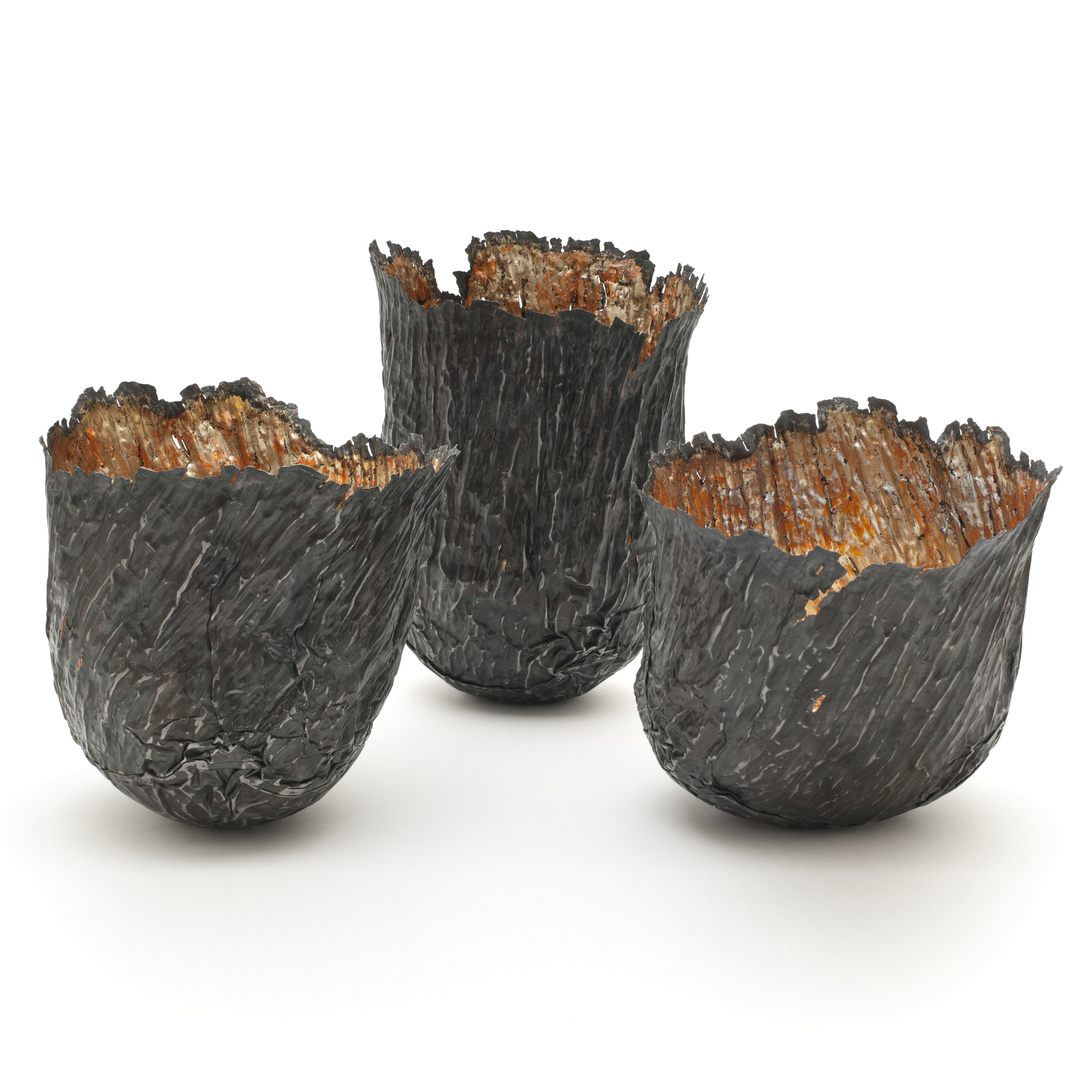 three steel copper and gold bowl art sculptures