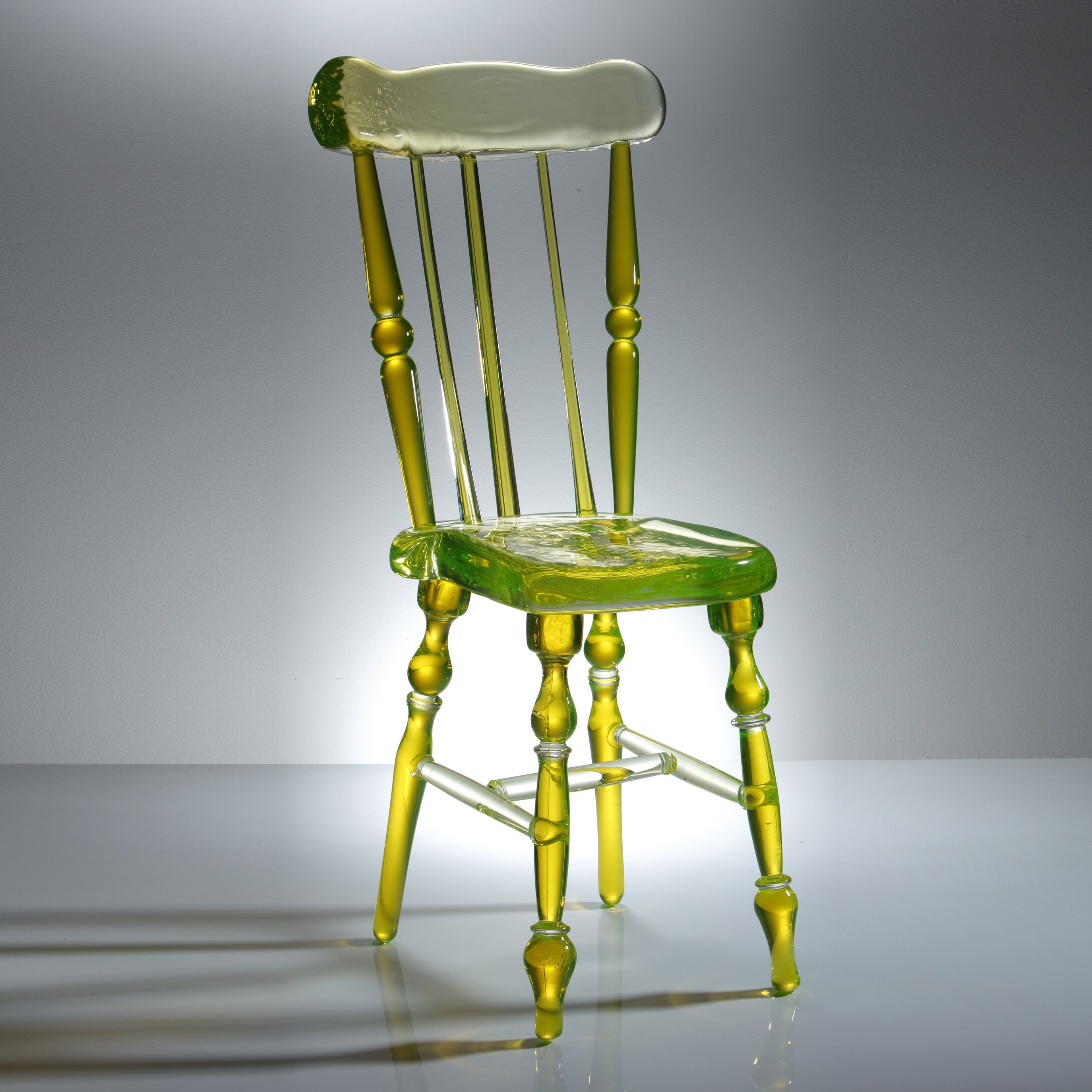 neon green coloured art glass sculpture of a chair