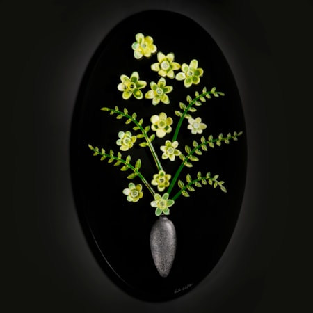 art glass sculpture of flowers in green and yellow on black background