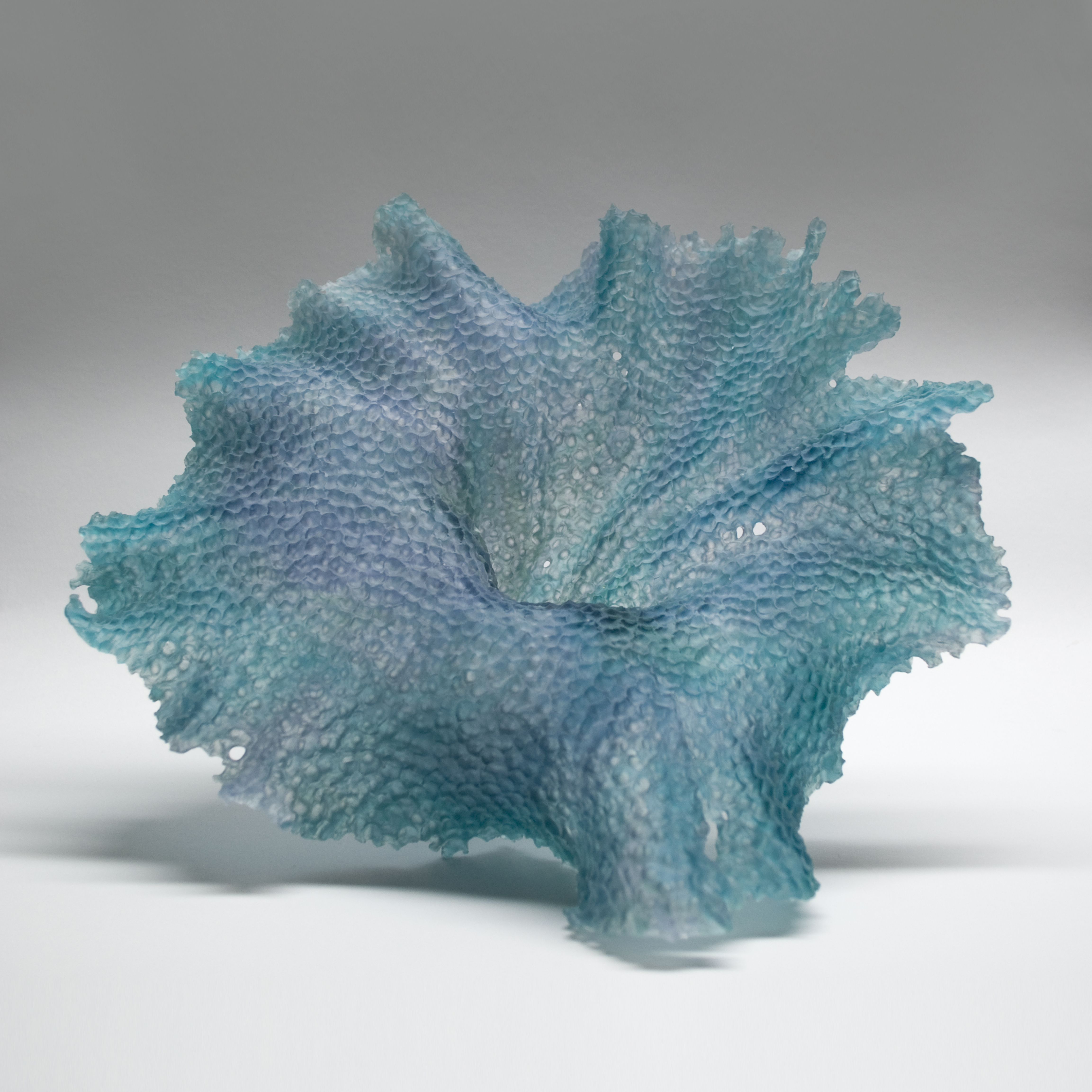 modern art glass sculpture of leaf in turquoise