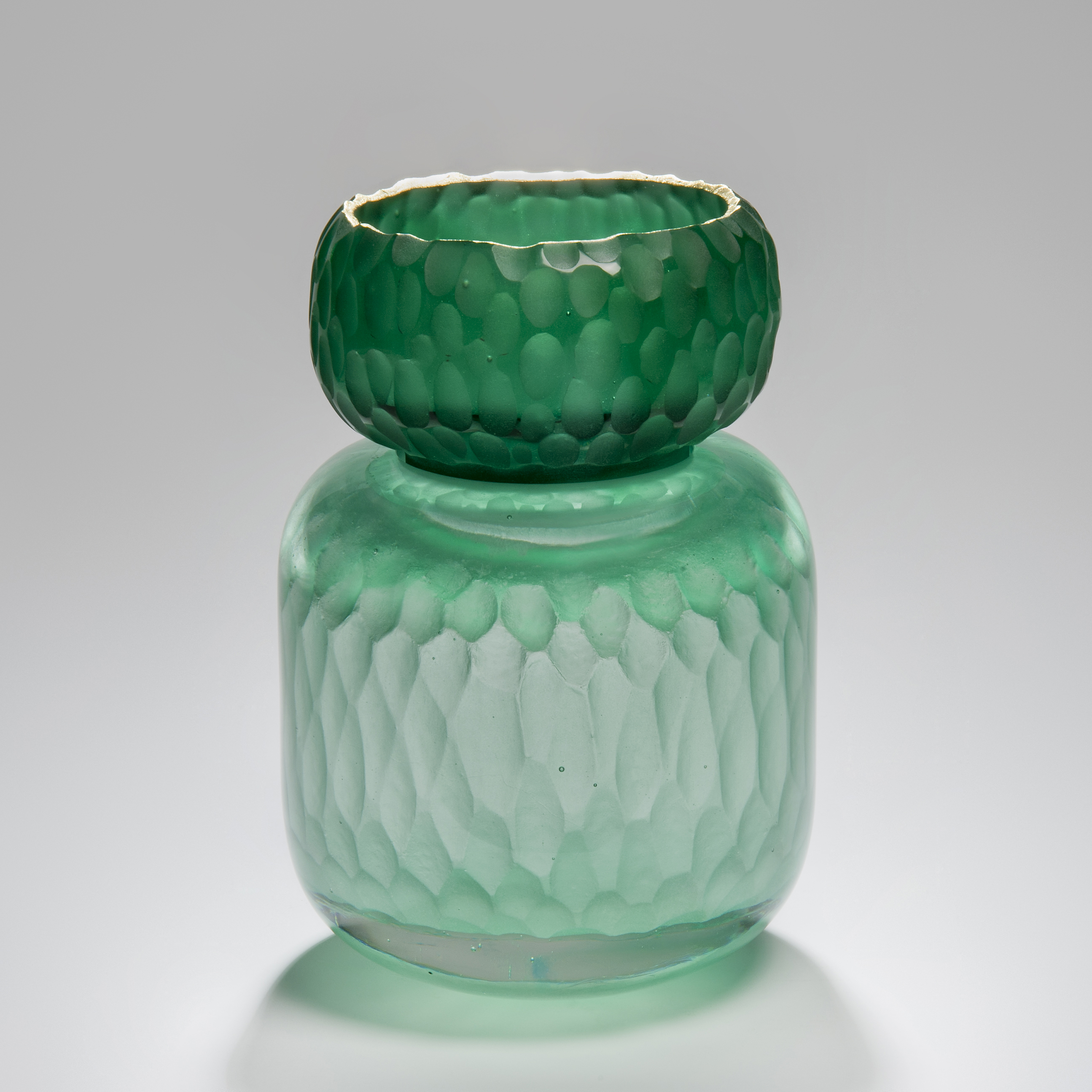 green sculpted glass jar artwork