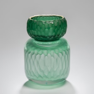 green sculpted glass jar artwork