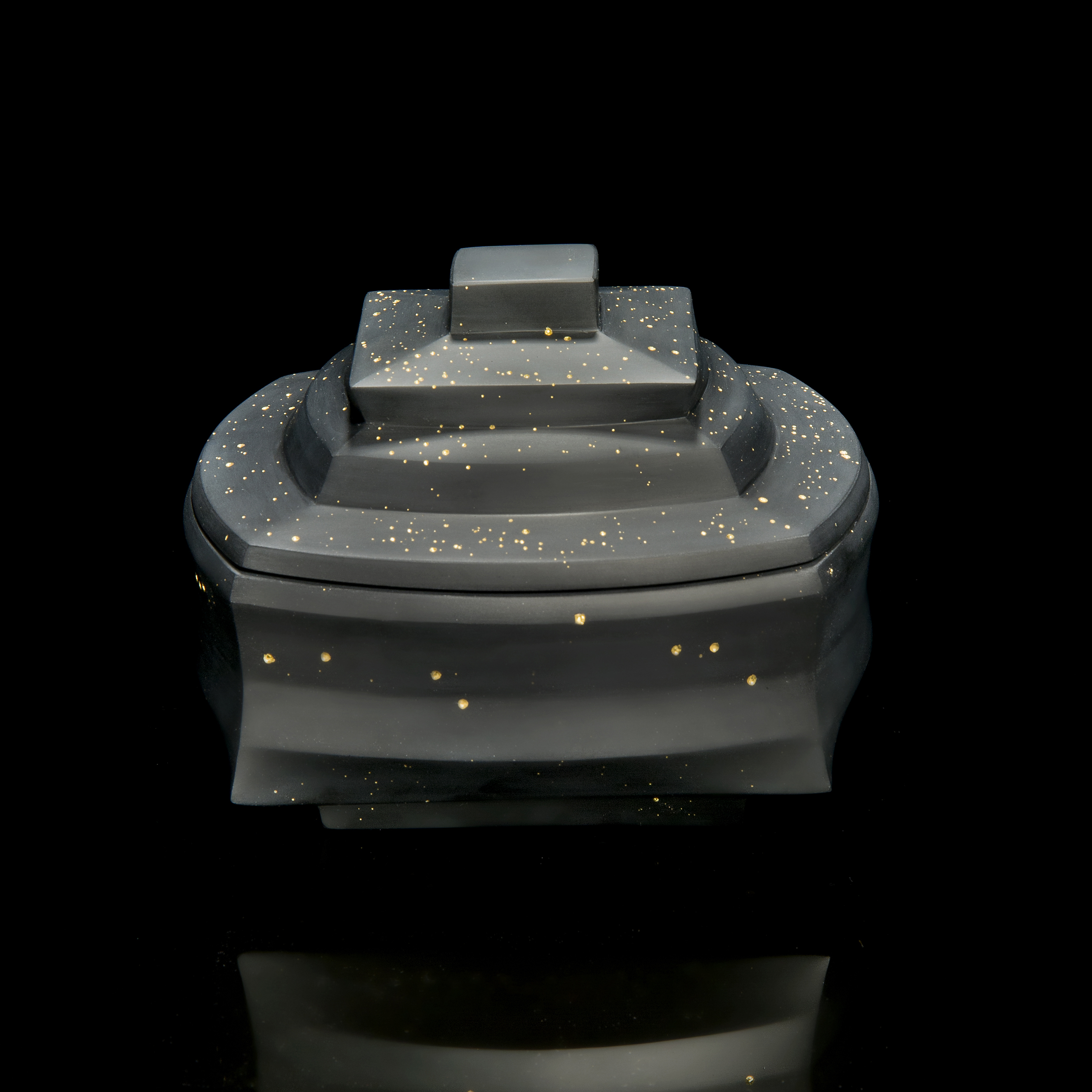 black cast glass sculptural art container with lid with gold speckles