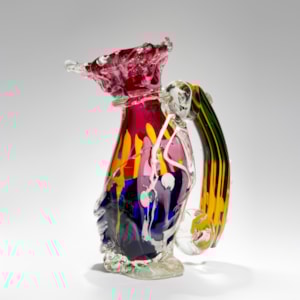 bright multicoloured ornamental art-glass sculpture of a jug