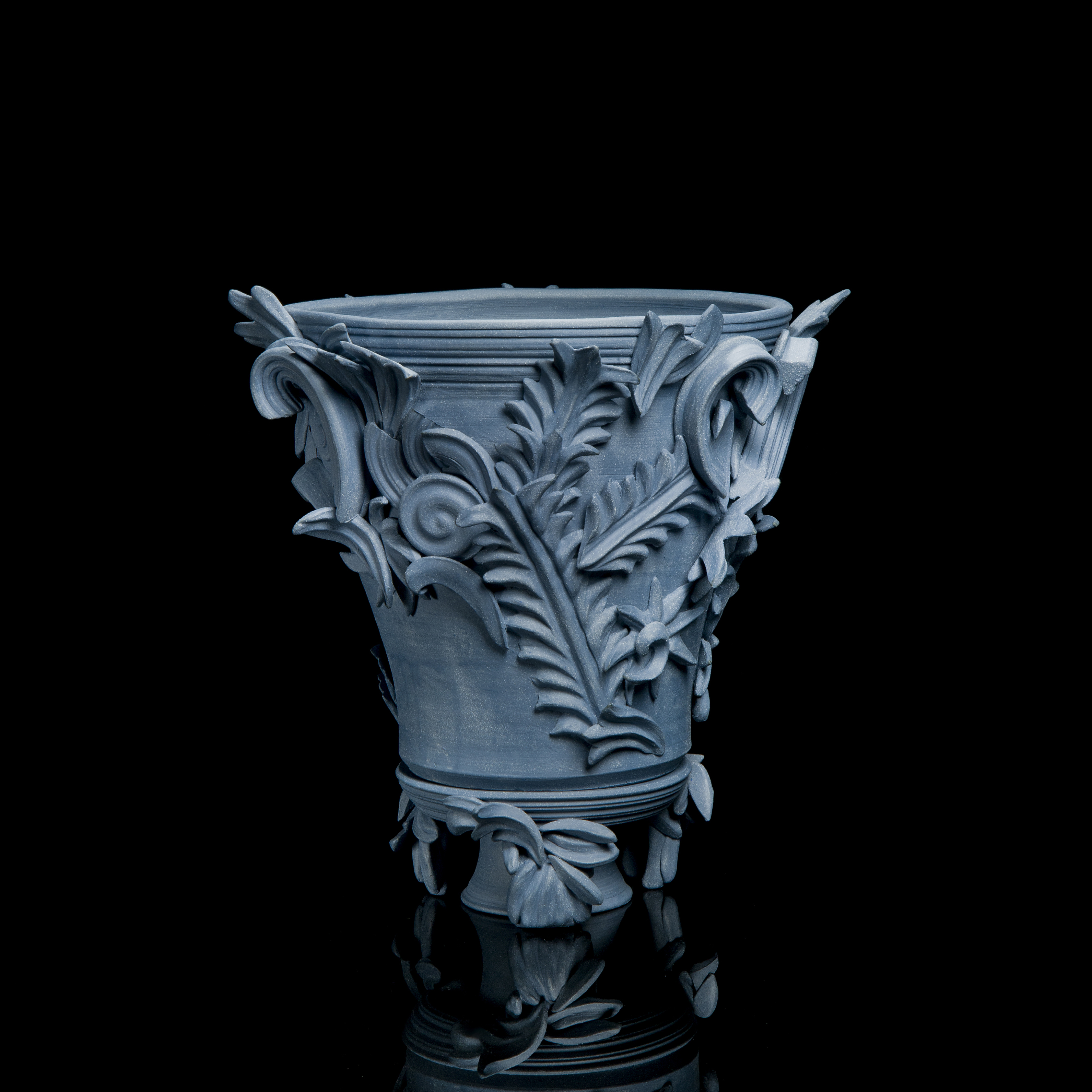 blue contemporary ceramic vase sculpture in classical style with classical flower trim 