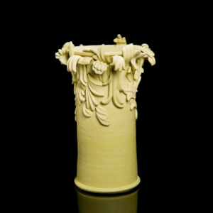 yellow contemporary ceramic vase sculpture in classical style with classical flower trim