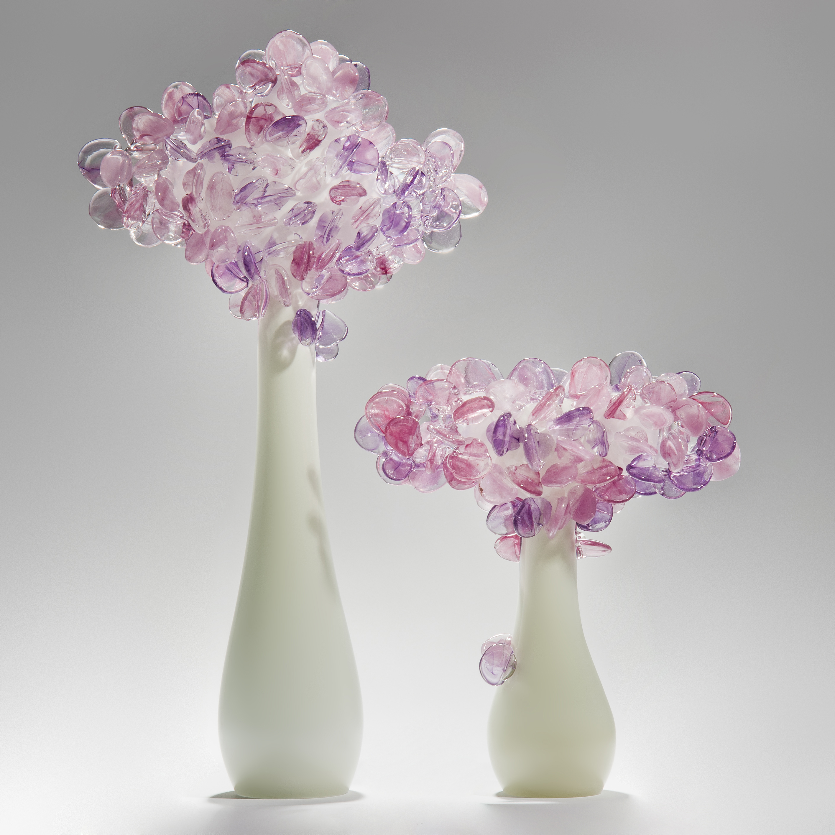 art glass sculpture of flowers in blue and pink