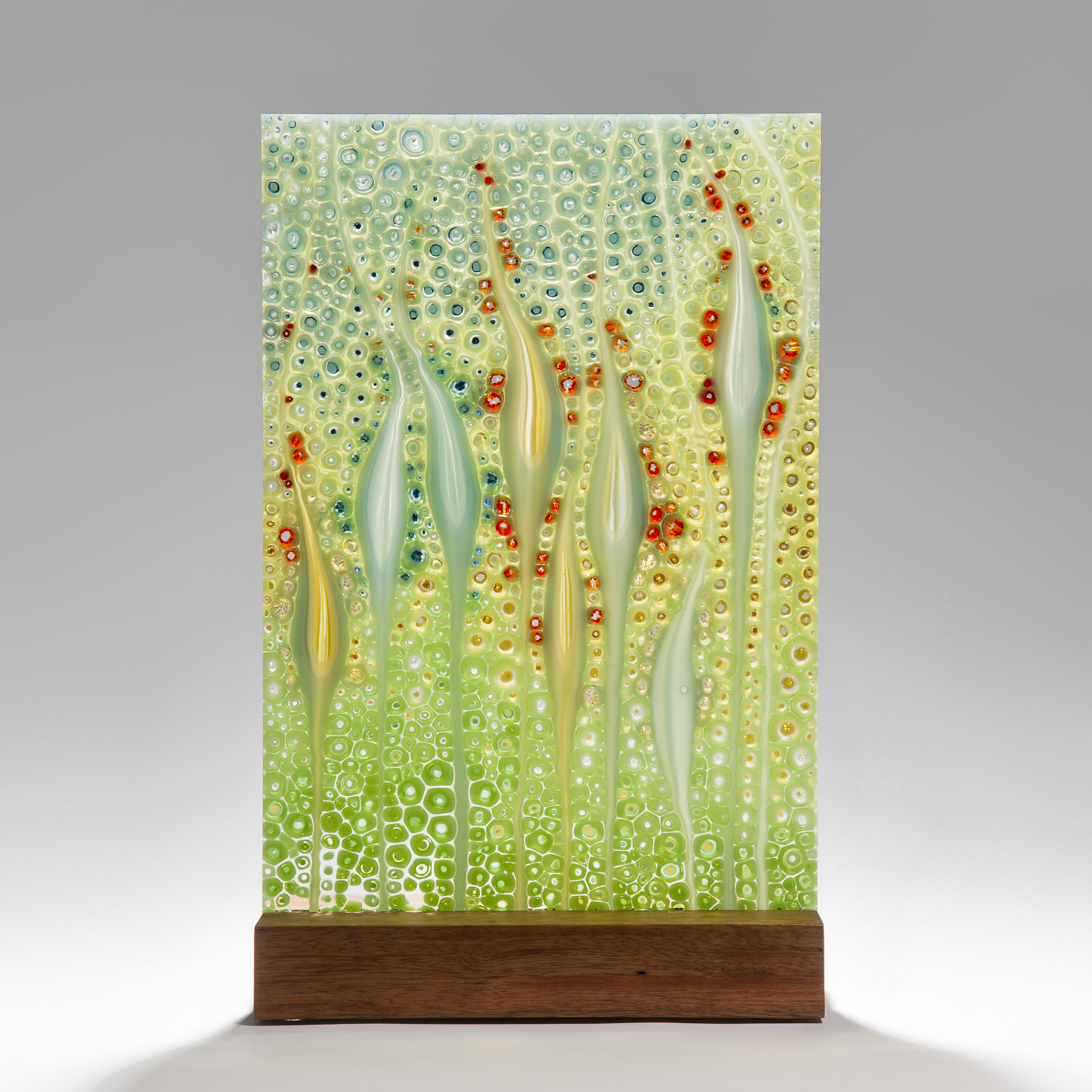 fused glass ornamental panel inspired by nature with walnut base 