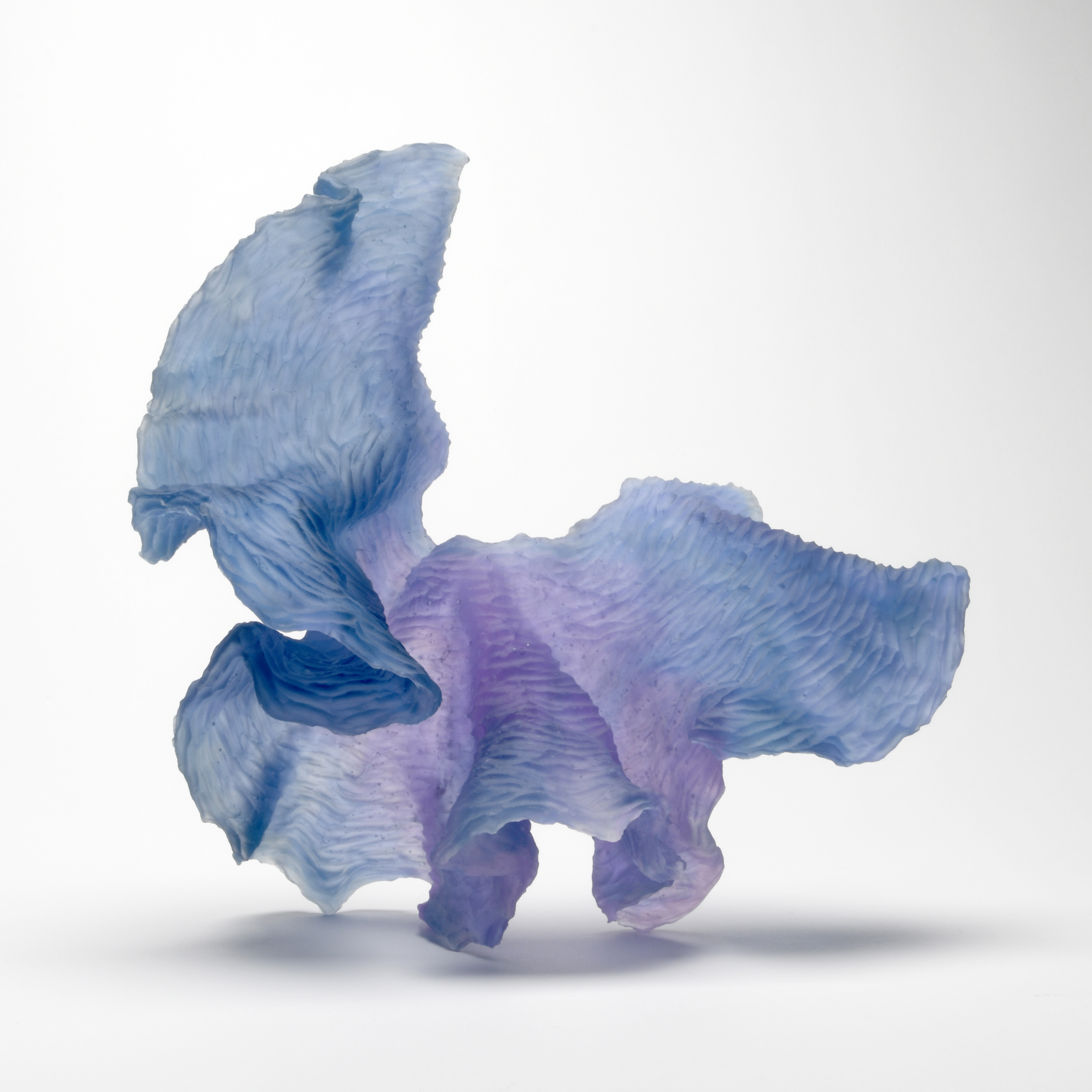 blue and pink cast art-glass sculpture with abstract shape